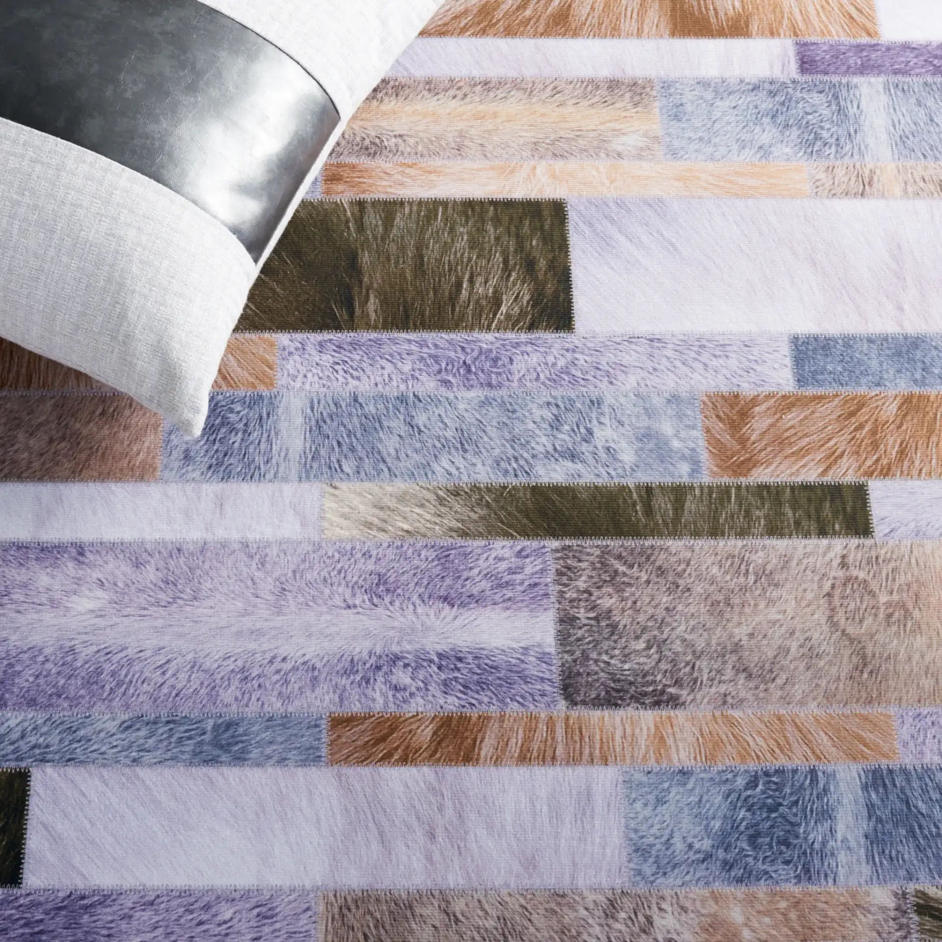 Faux Hide Linear Patchwork Washable Rug in Beige / Purple in a styled room