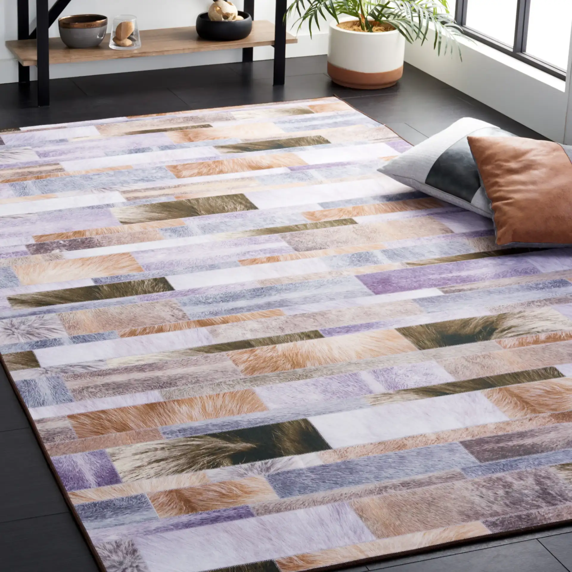 Faux Hide Linear Patchwork Washable Rug in Beige / Purple in a styled room