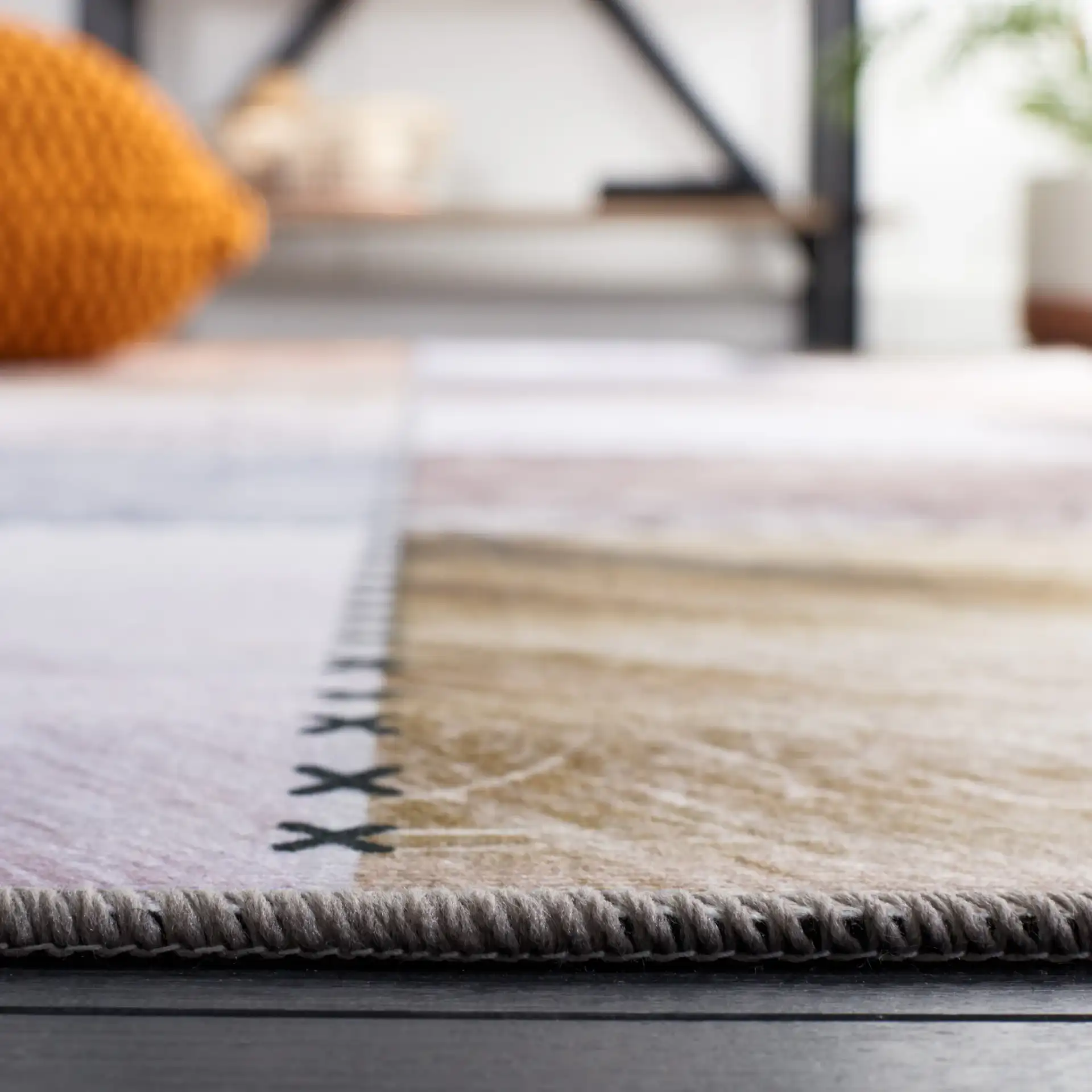 Faux Hide Patchwork Washable Rug in Beige / Brown in a styled room