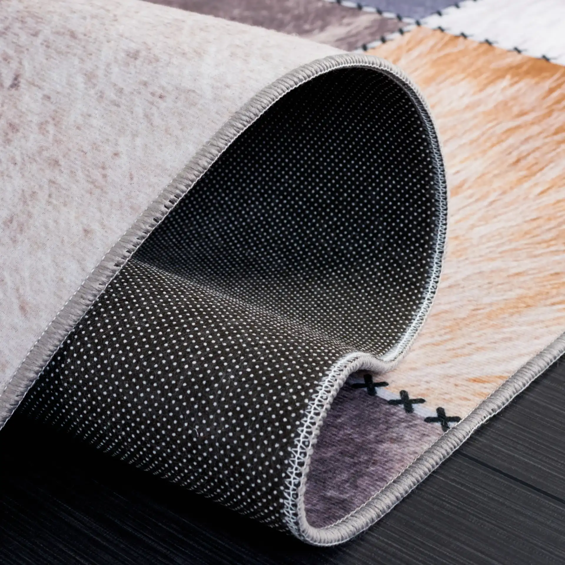 Faux Hide Patchwork Washable Rug in Beige / Brown in a styled room
