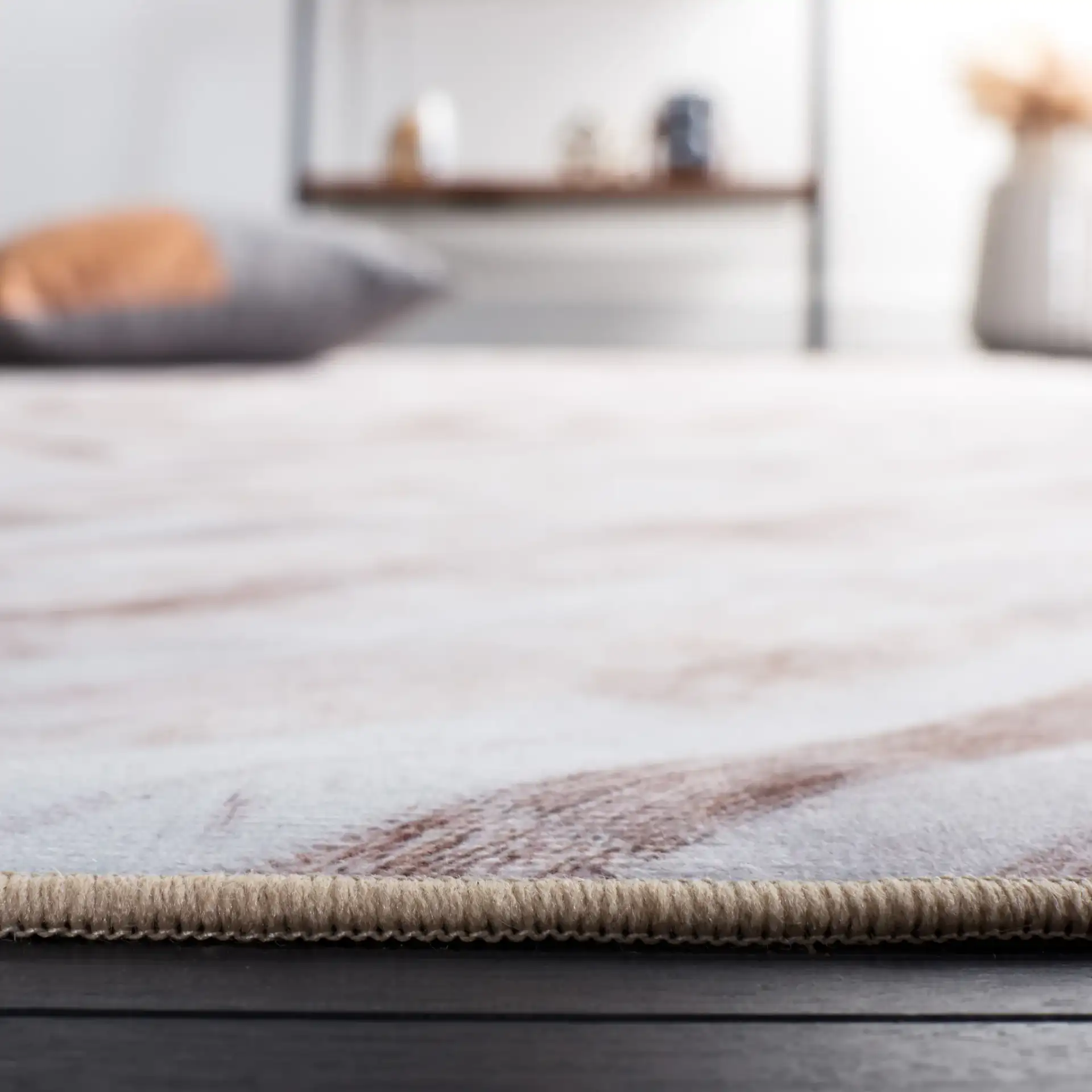 Faux Hide Patchwork Diamond Washable Rug in Beige / Brown in a styled room