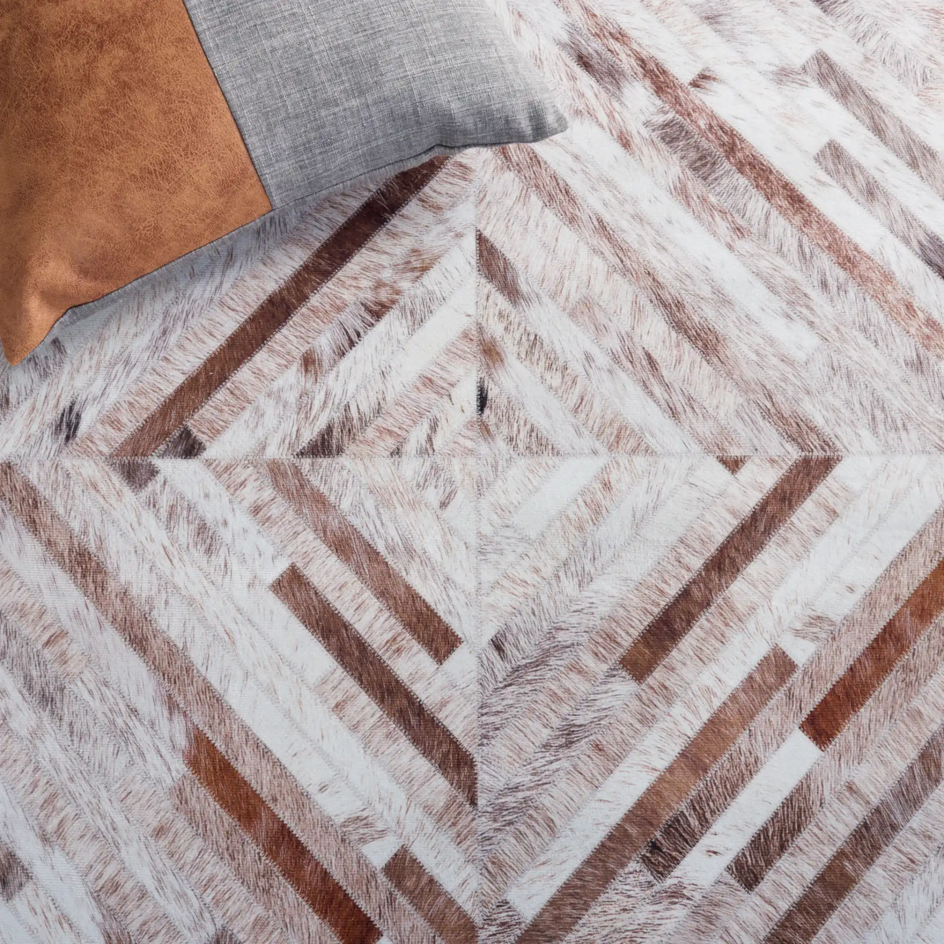 Faux Hide Patchwork Diamond Washable Rug in Beige / Brown in a styled room
