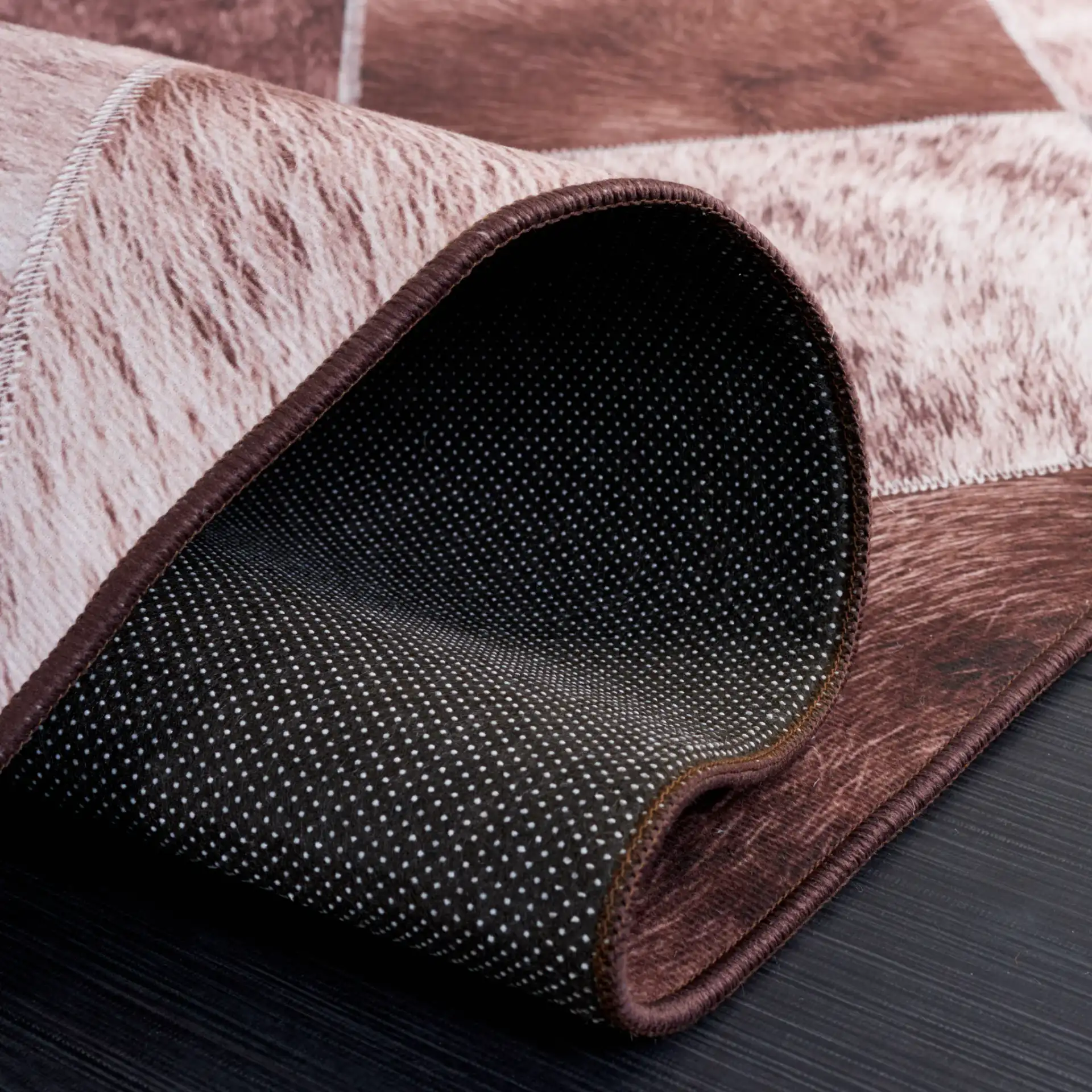 Faux Hide Diamond Patchwork Washable Rug in Light Brown / Brown in a styled room