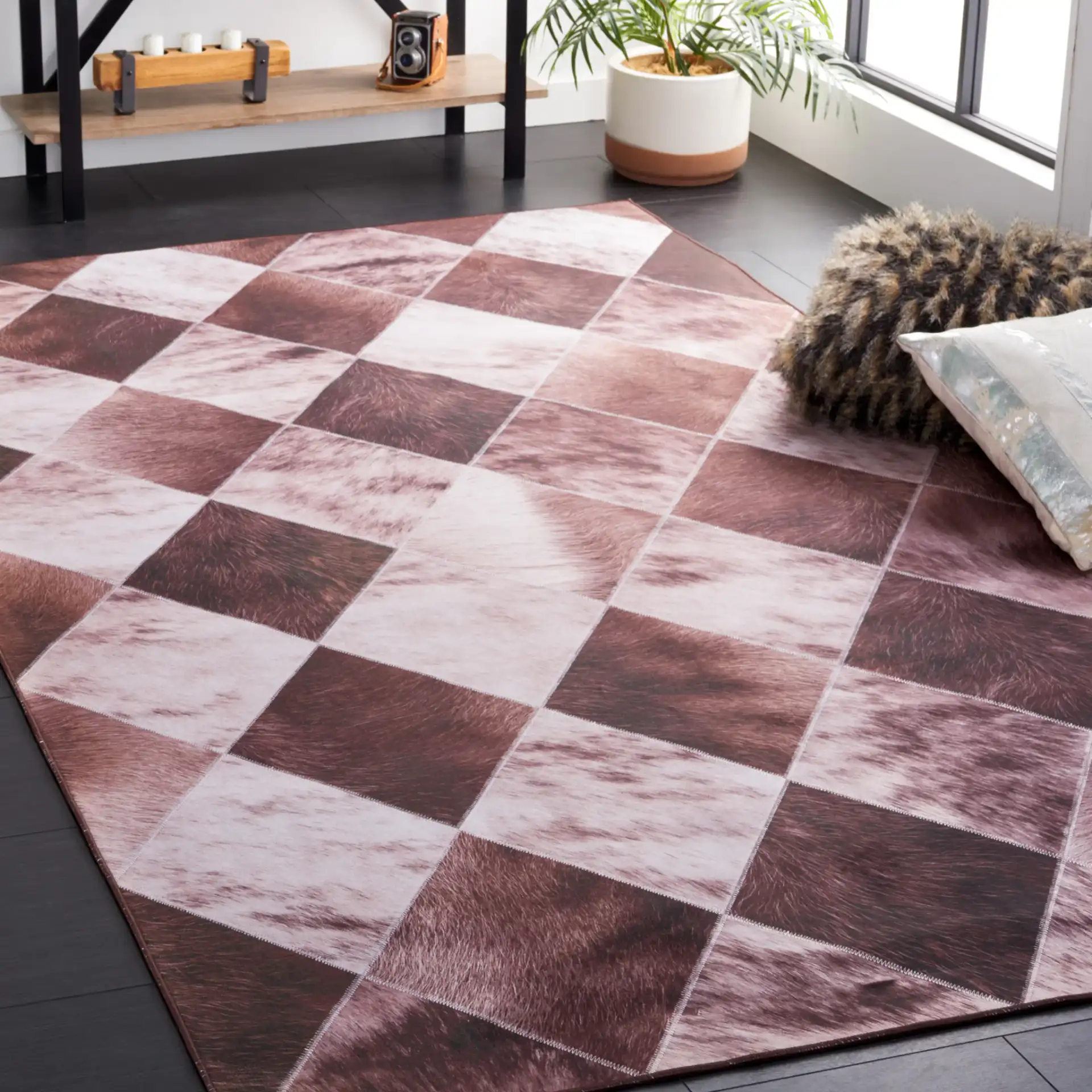 Faux Hide Diamond Patchwork Washable Rug in Light Brown / Brown in a styled room