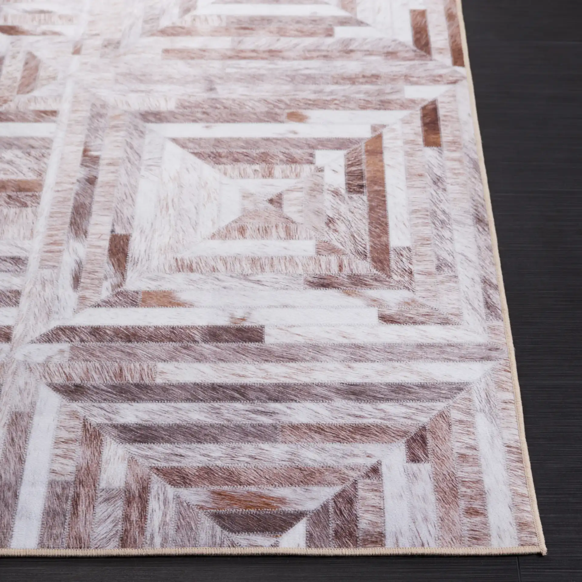Faux Hide Concentric Square Patchwork Washable Rug in Beige / Brown in a styled room