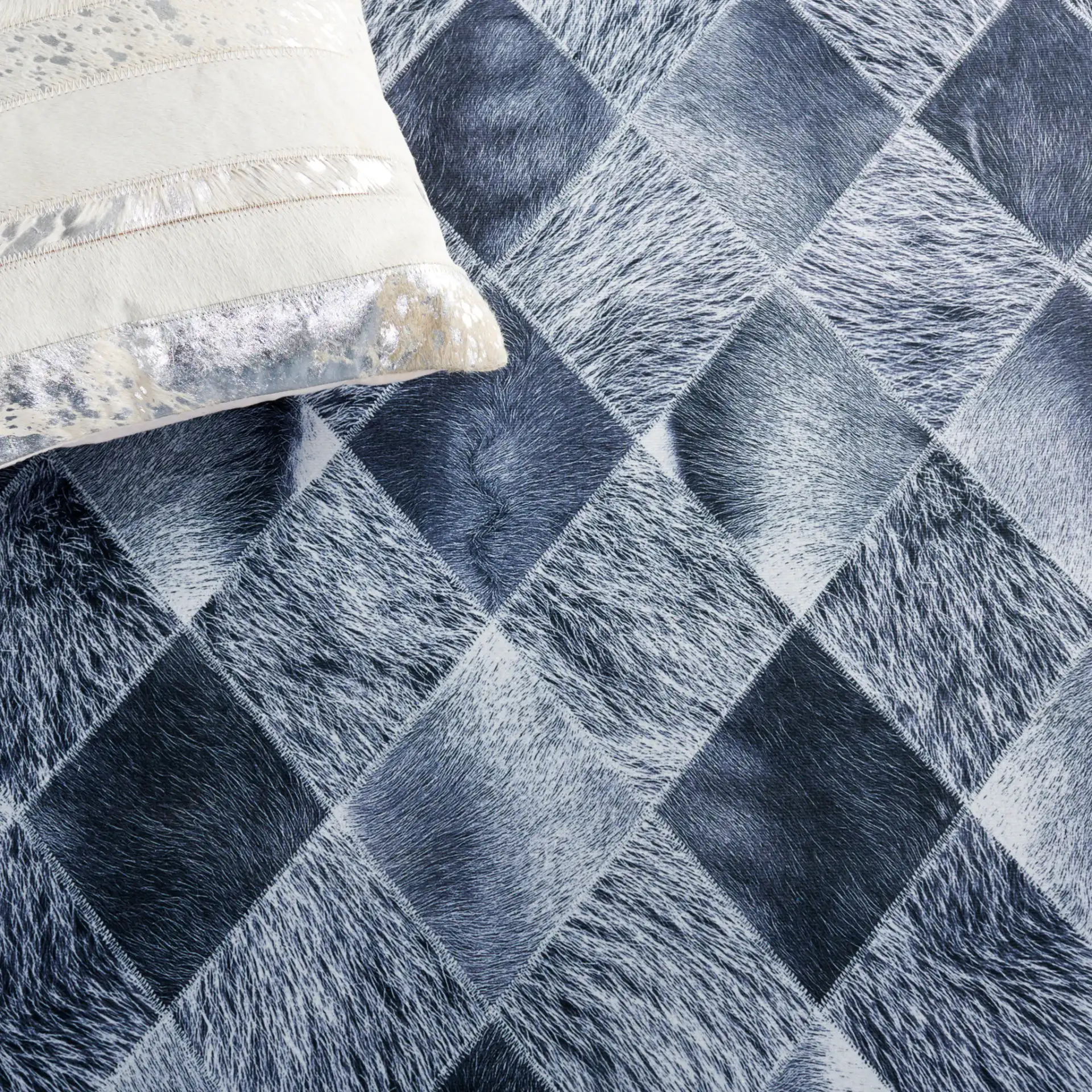 Faux Hide Harlequin Patchwork Washable Rug in Gray / Dark Gray in a styled room