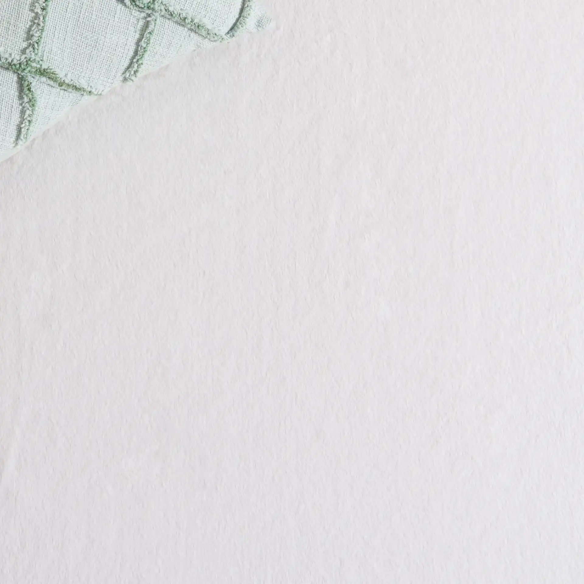 Faux Fur Solid Washable Rug in Ivory in a styled room