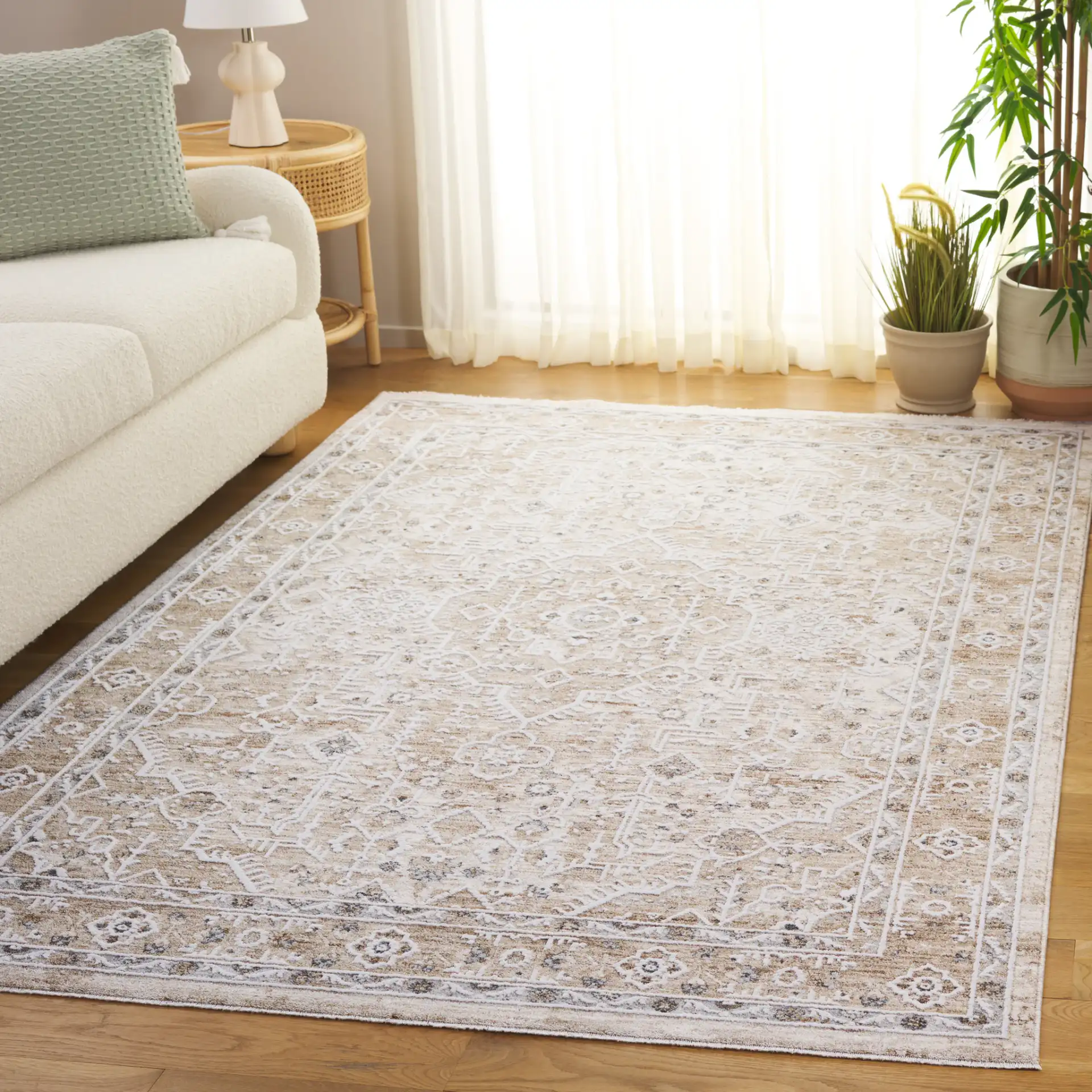 Finley Medallion Bordered Rug in Beige / Ivory in a styled room