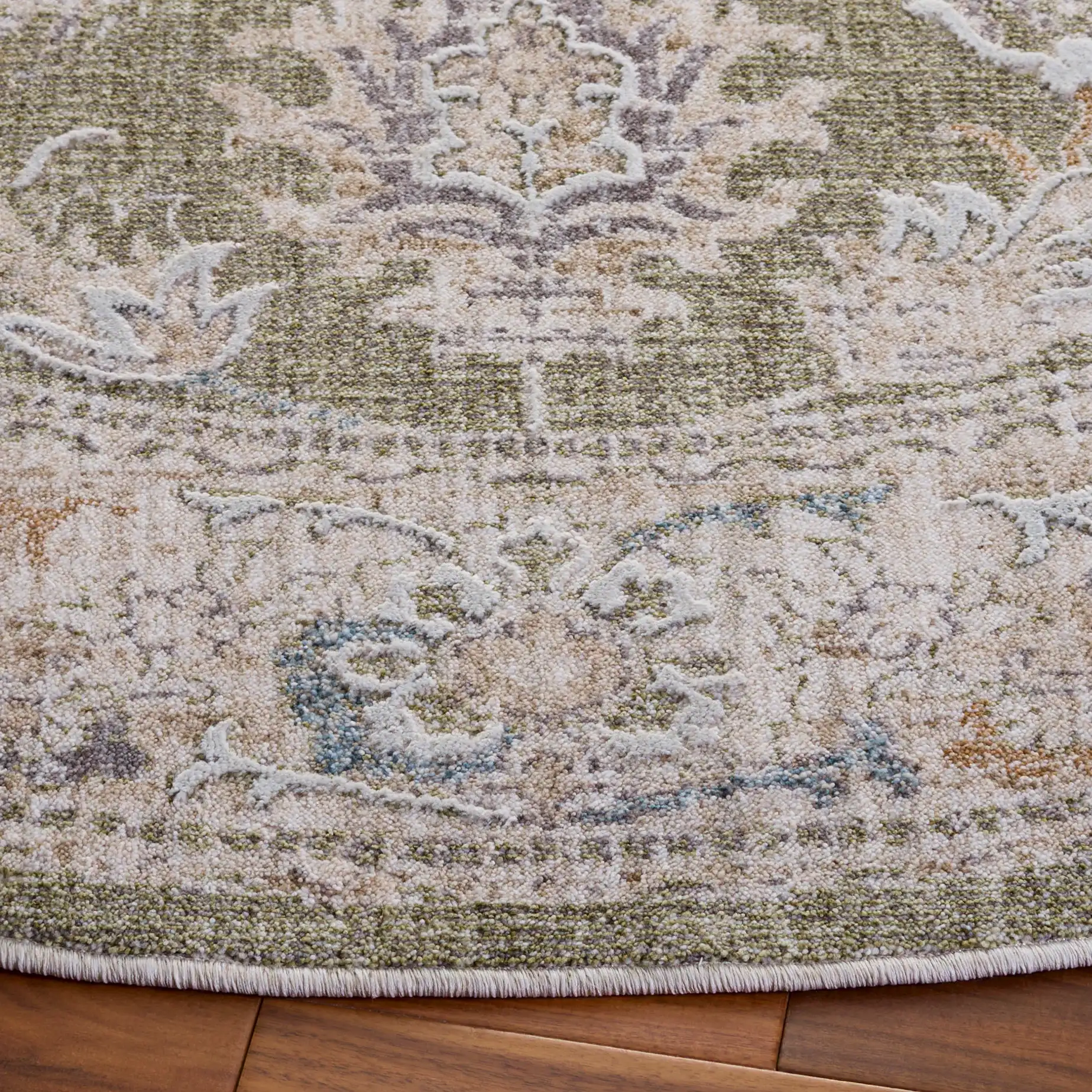 Finley Botanical Border Rug in Green / Beige in a styled room