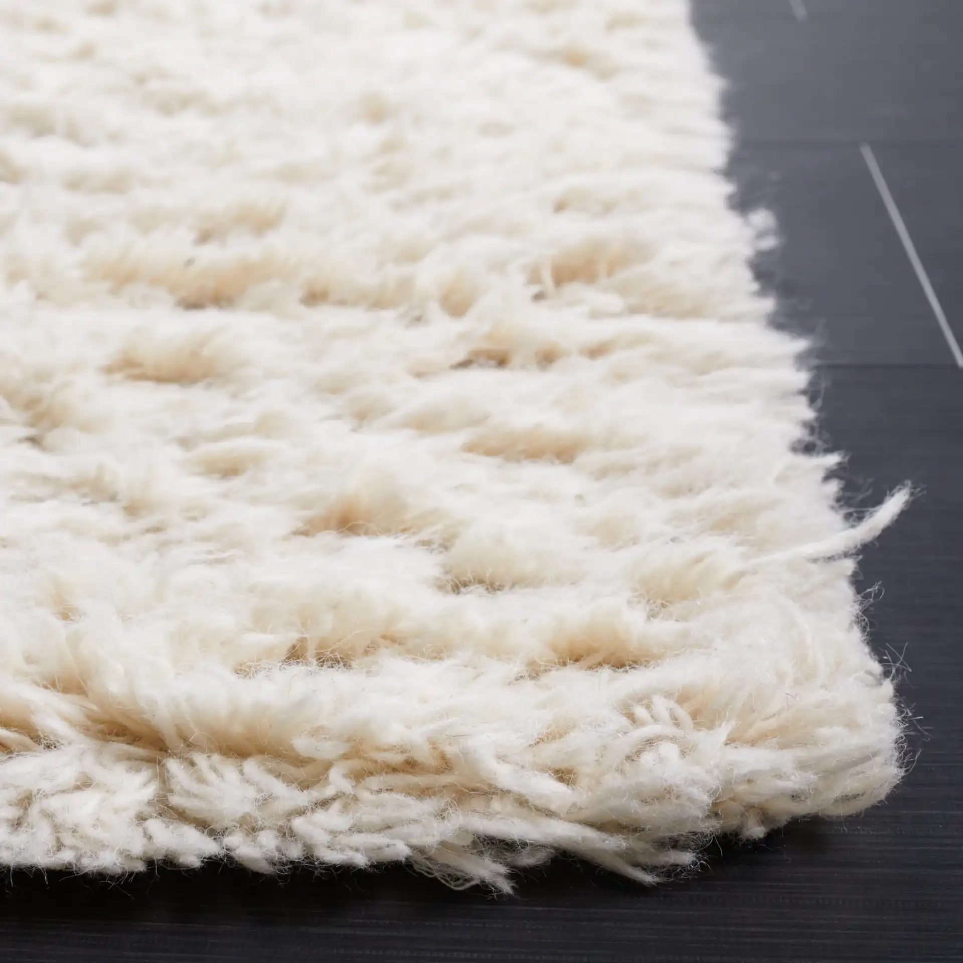 Flokati Solid Hand-Tufted Wool Shag Rug in Ivory in a styled room