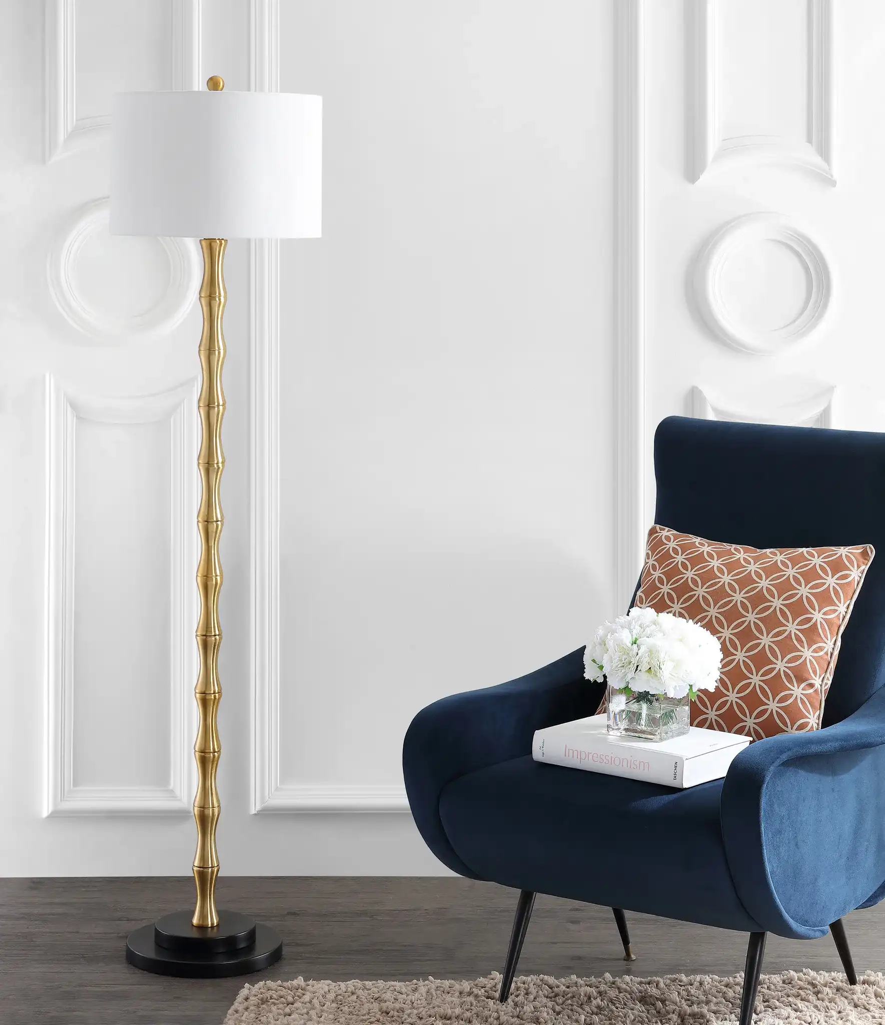 Kolten Floor Lamp in Brass in a styled room