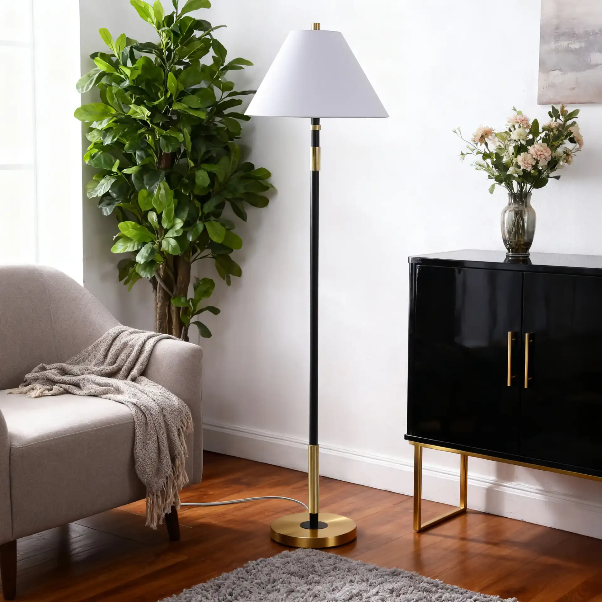Naora Floor Lamp in Brown / Brass in a styled room