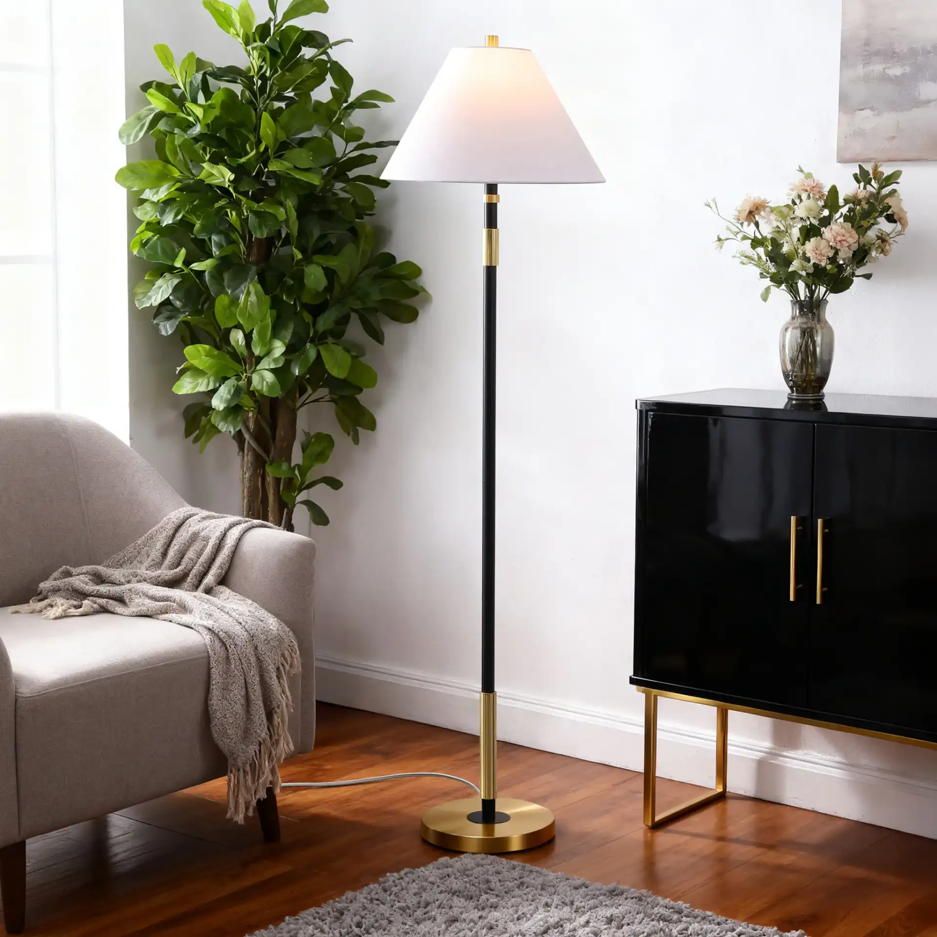 Naora Floor Lamp in Brown / Brass in a styled room