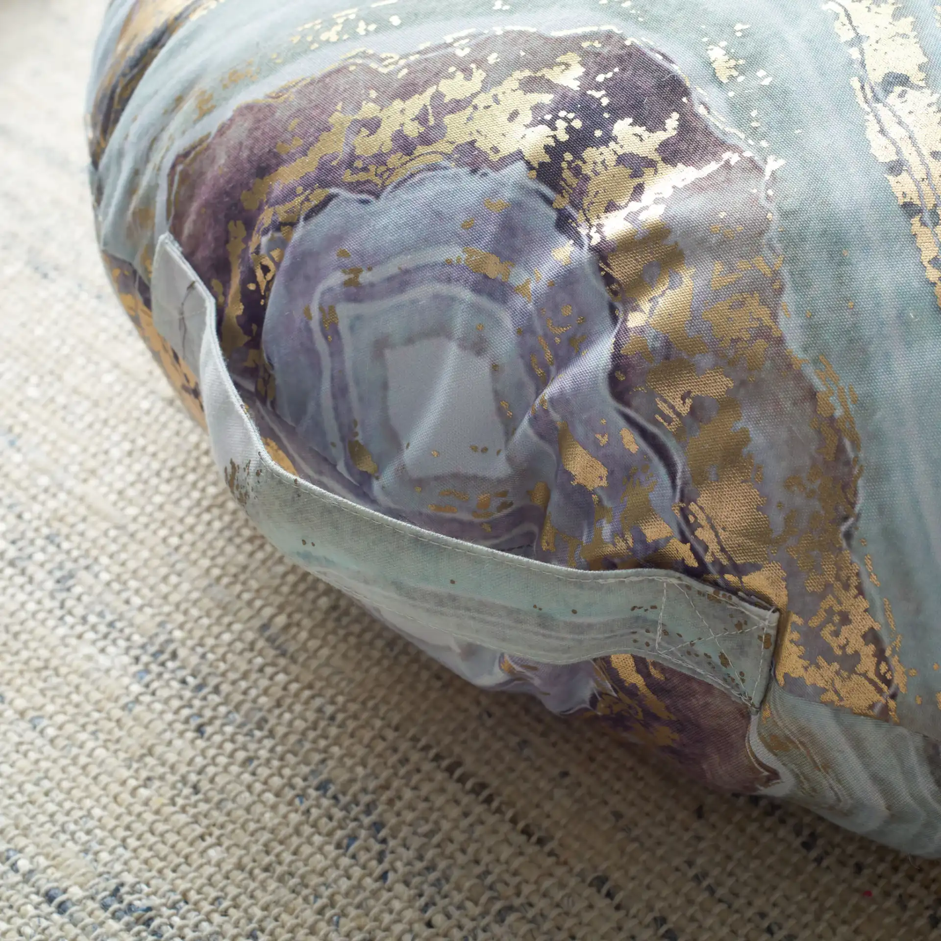 Nima Round Floor Pillow in Assorted in a styled room