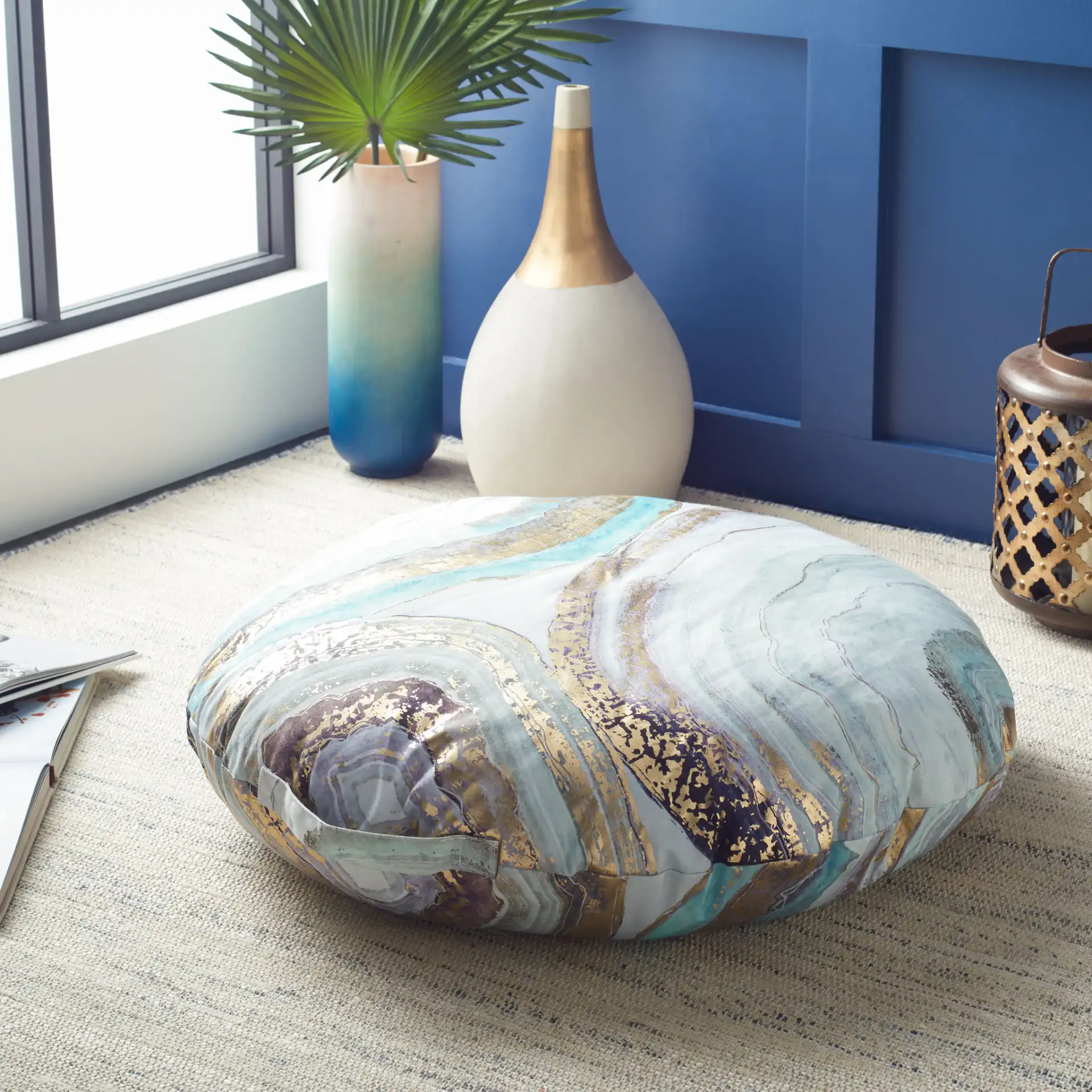 Nima Round Floor Pillow in Assorted in a styled room