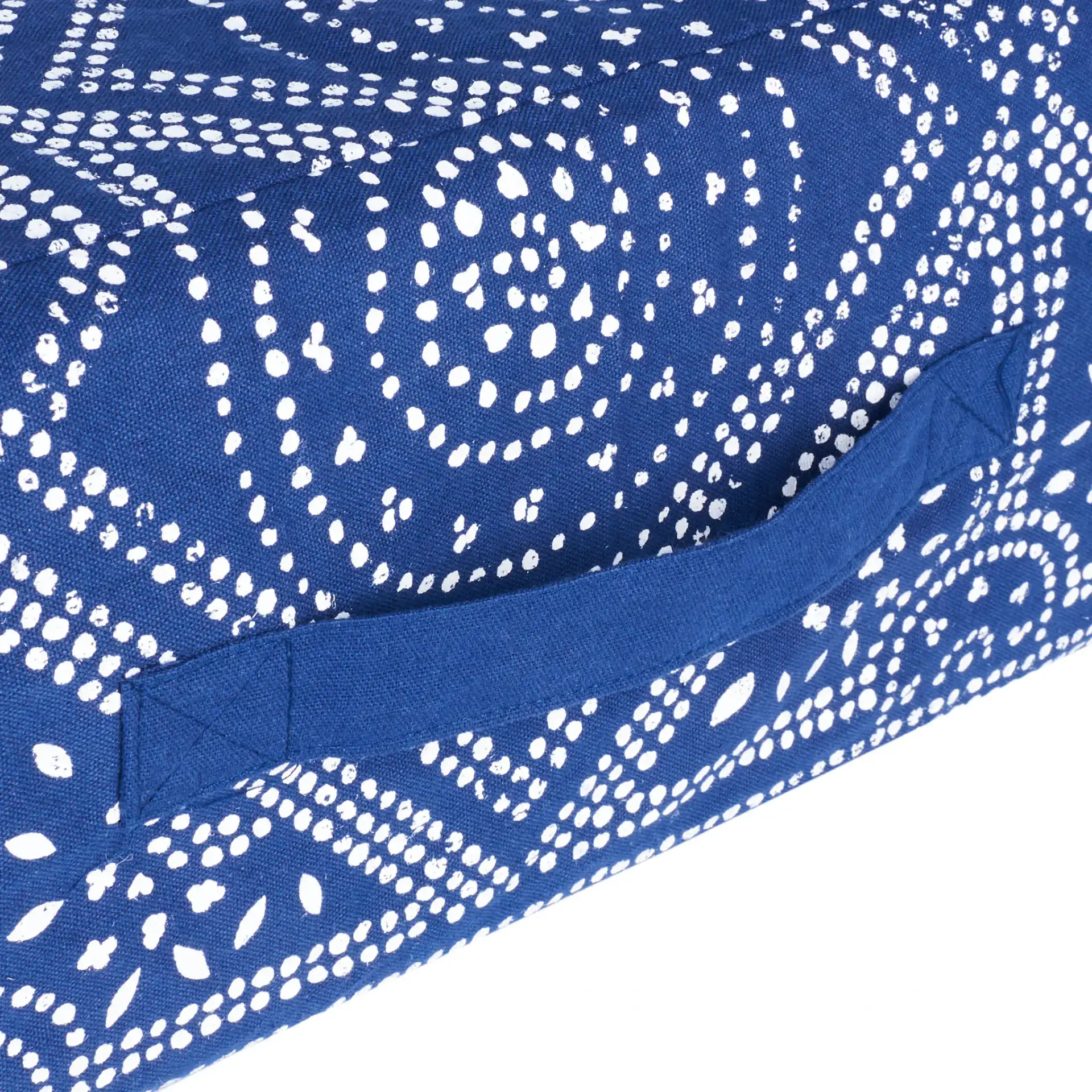 Valenti Square Floor Pillow in Navy Blue / White in a styled room