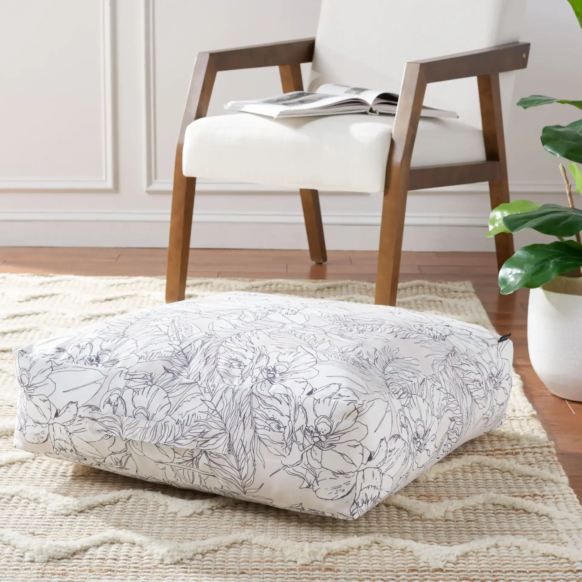 Matlea Floor Pillow in Beige / Gray in a styled room