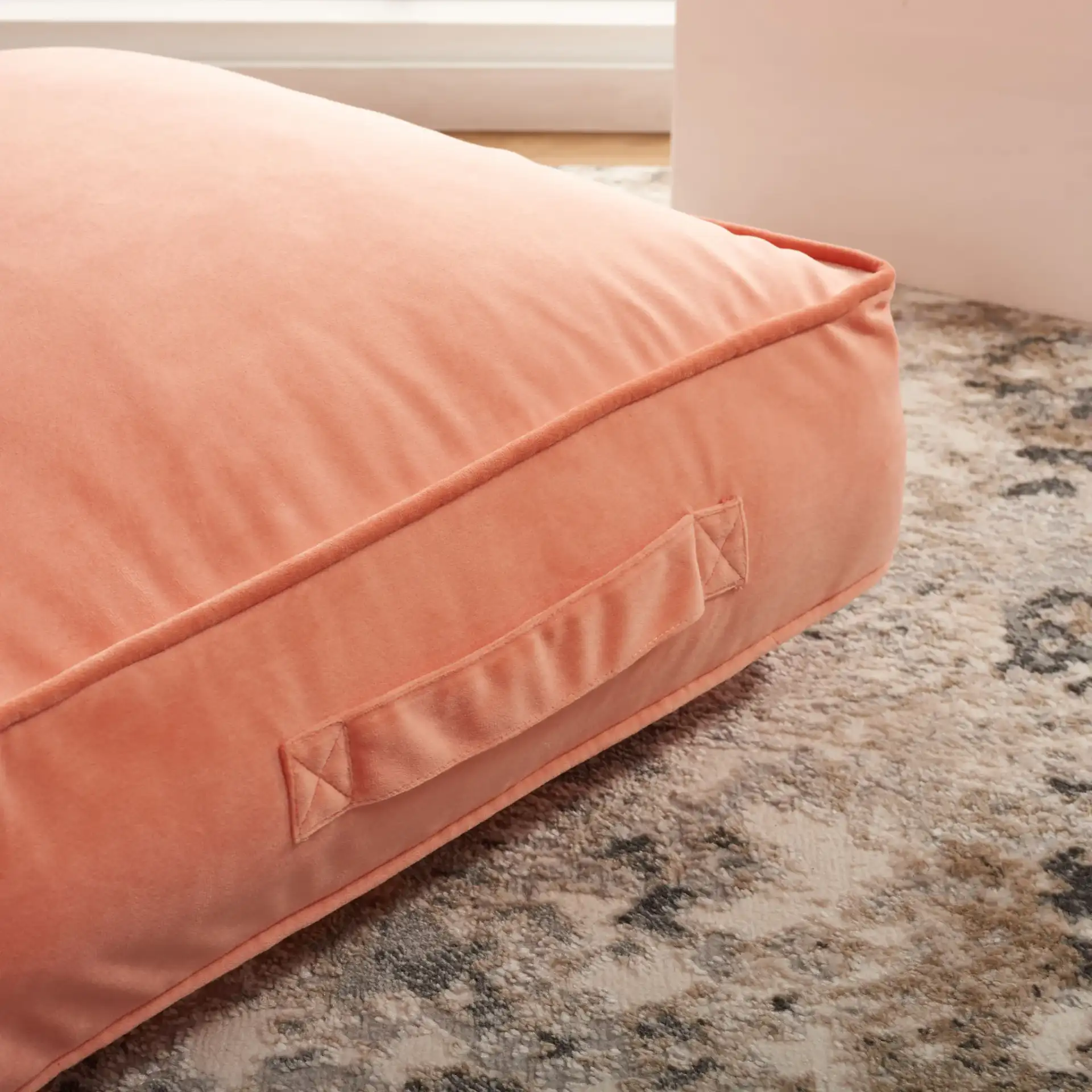 Dulcie Floor Pillow in Peach in a styled room
