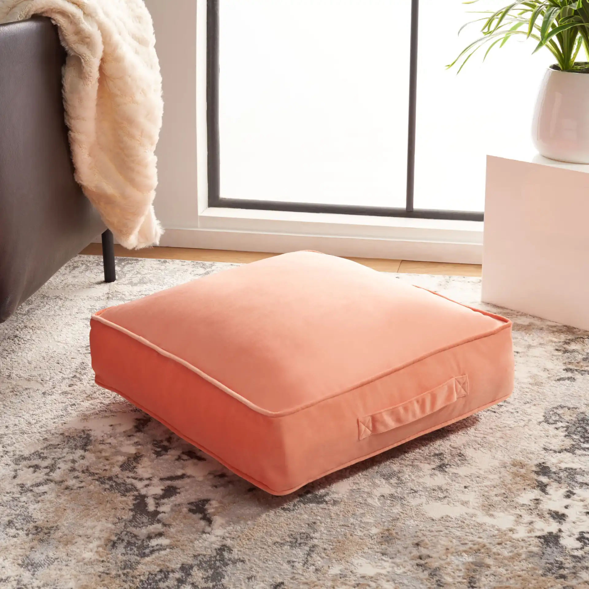 Dulcie Floor Pillow in Peach in a styled room
