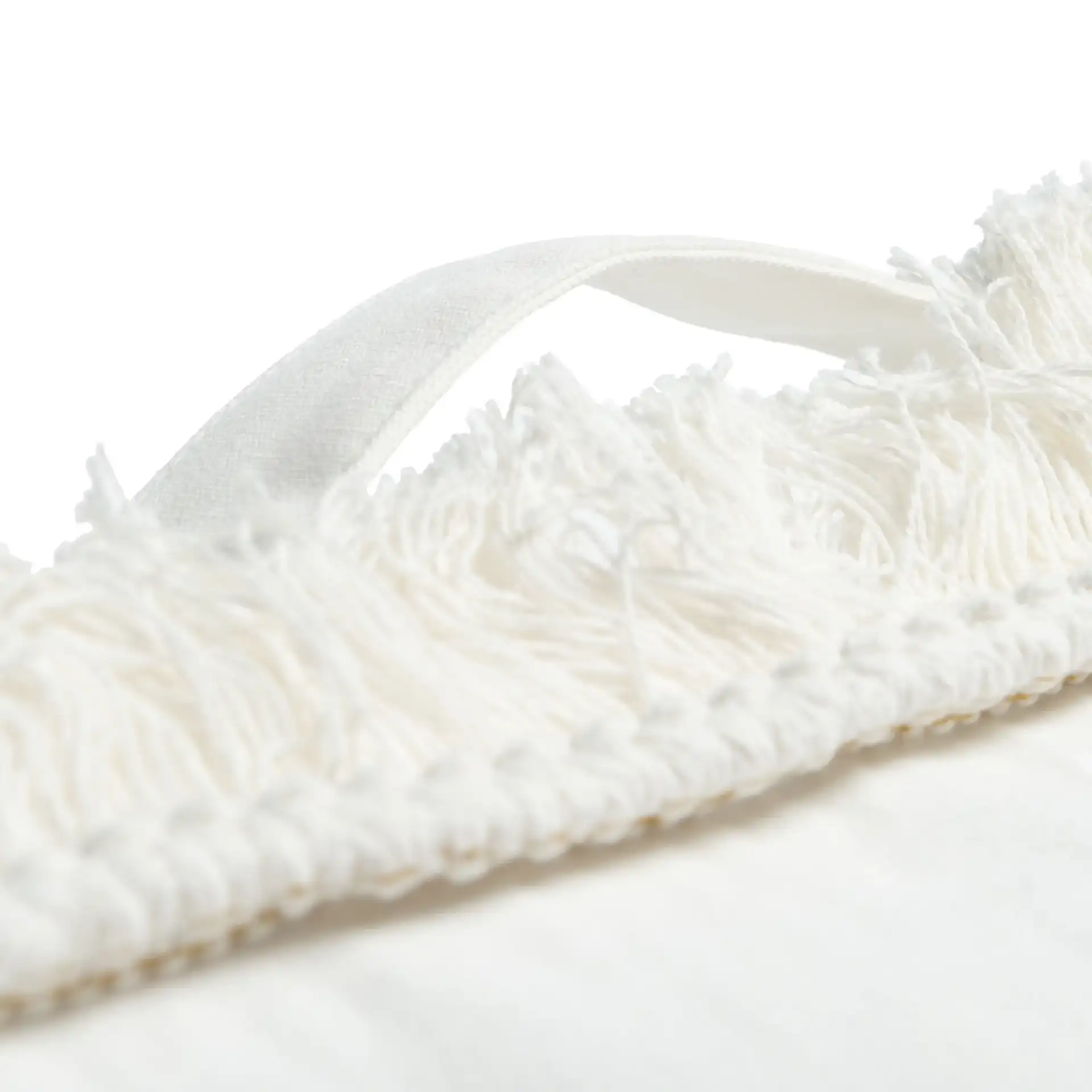 Grema Floor Pillow in Ivory in a styled room