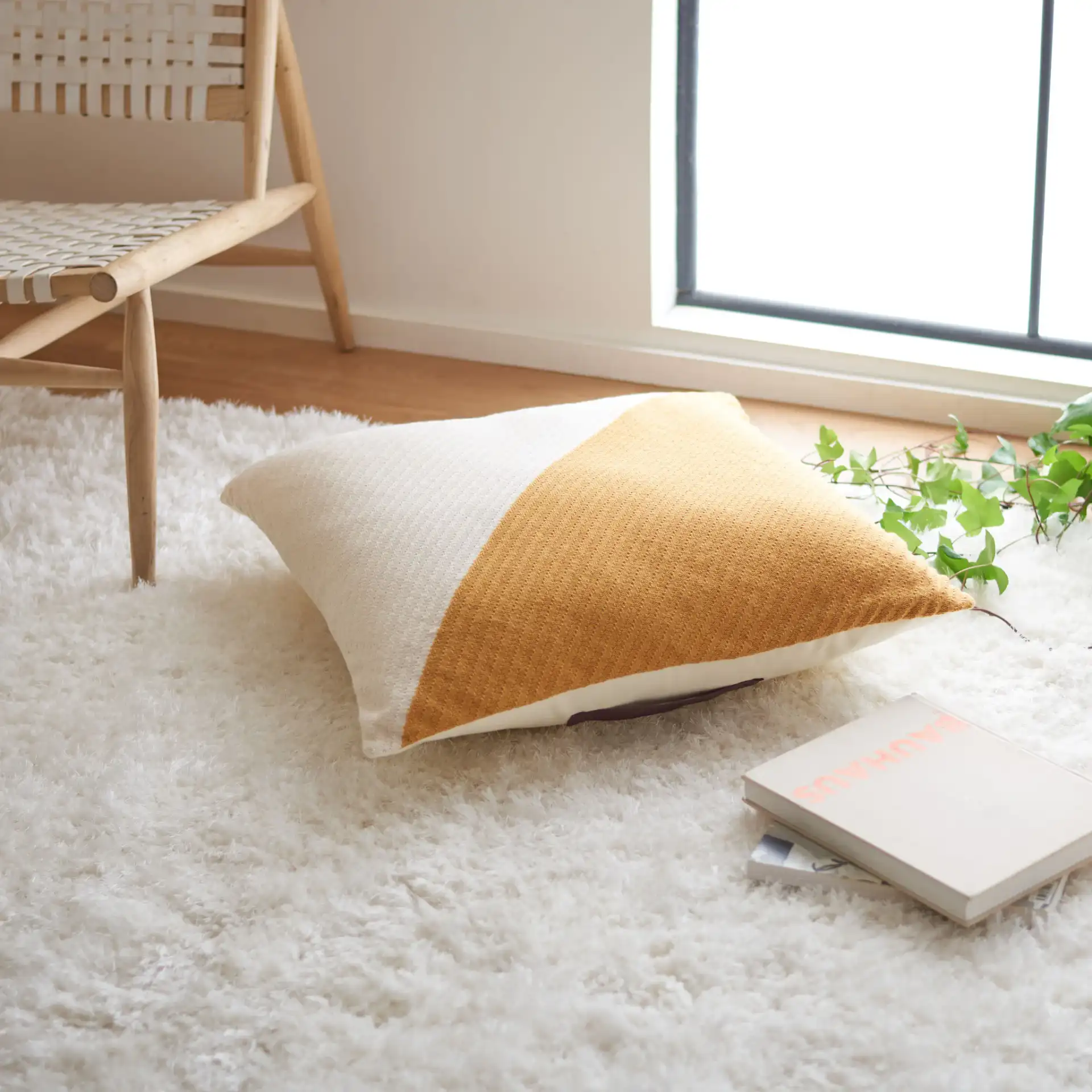 Nyssa Floor Pillow in Mustard / Beige in a styled room