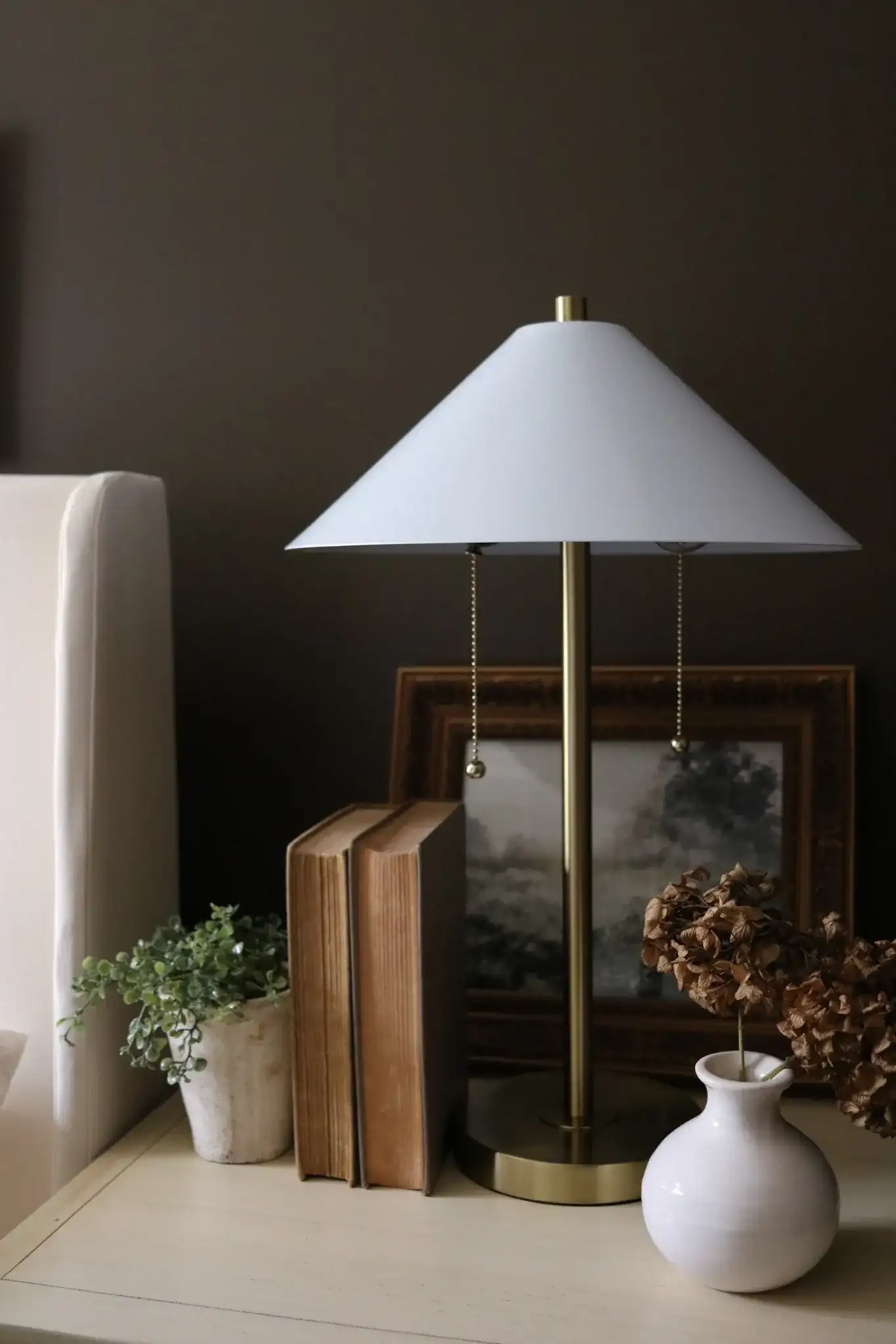 Prisma Three-Piece Floor And Table Lamp Set in Brass Gold in a styled room