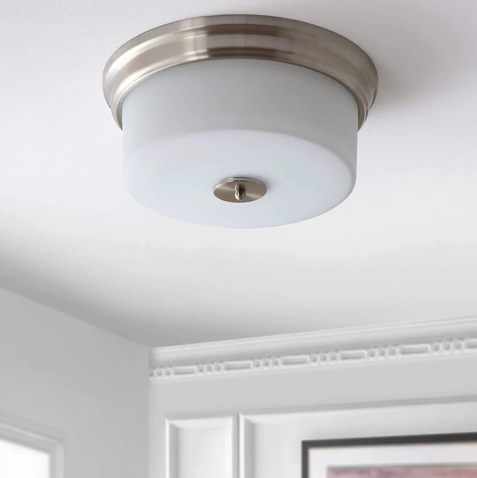 Dalen Flush Mount in White in a styled room