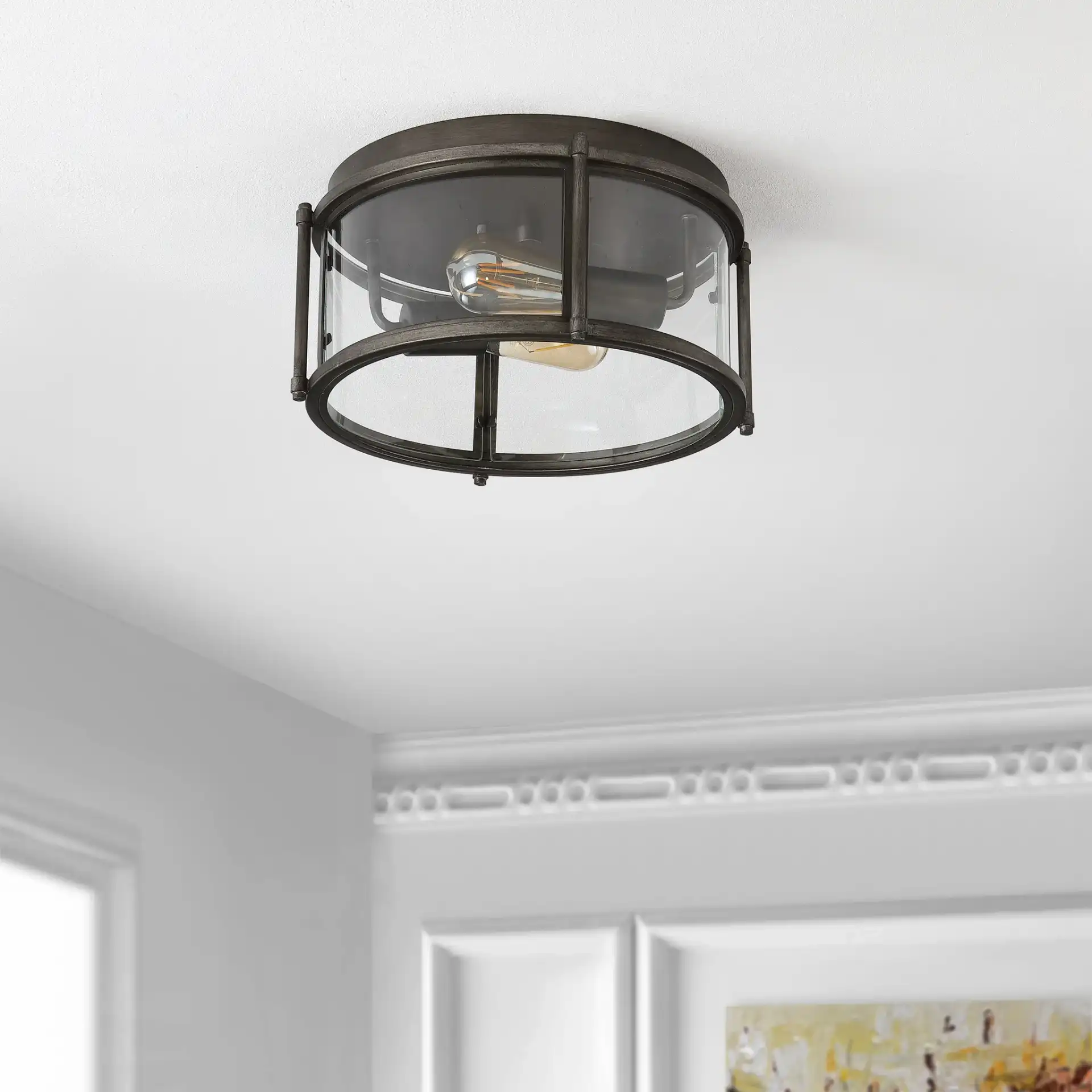 Tiller Two-Light Flush Mount in Antique Silver in a styled room
