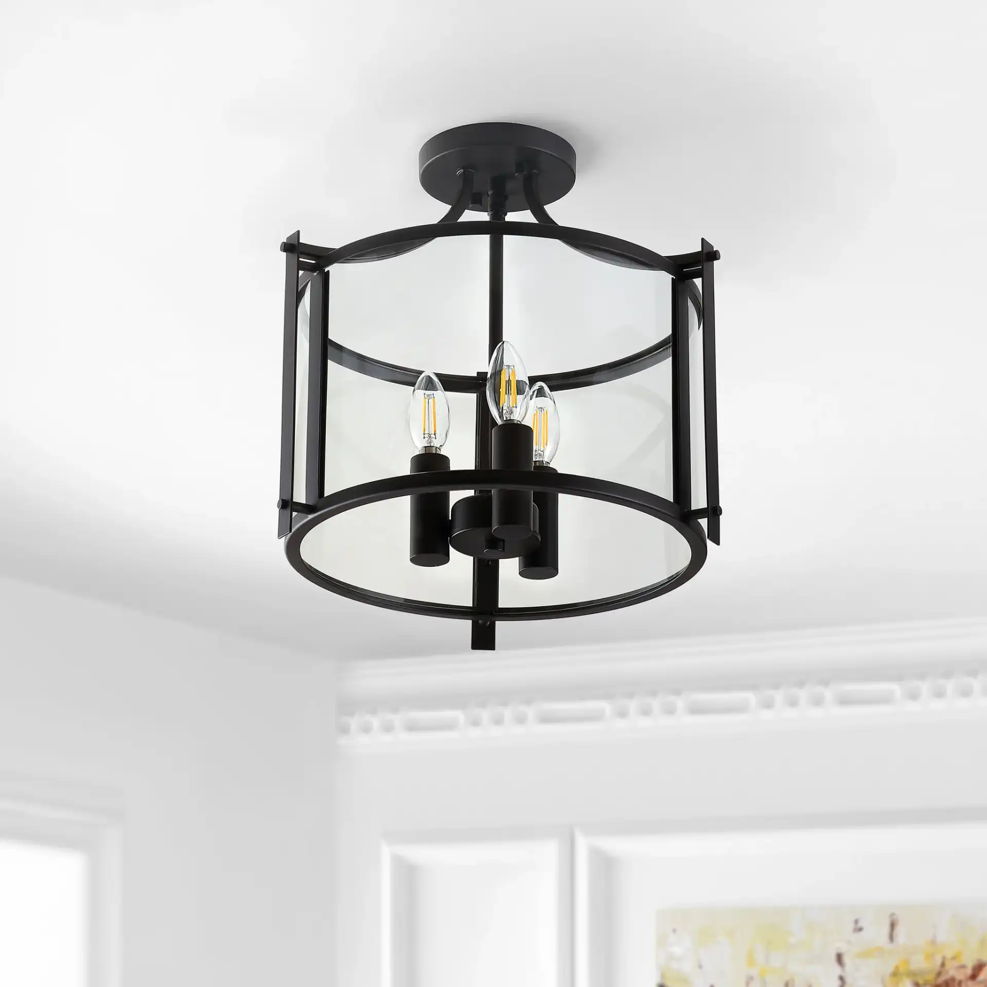 Grenten Three-Light Pendant in Bronze / Clear in a styled room
