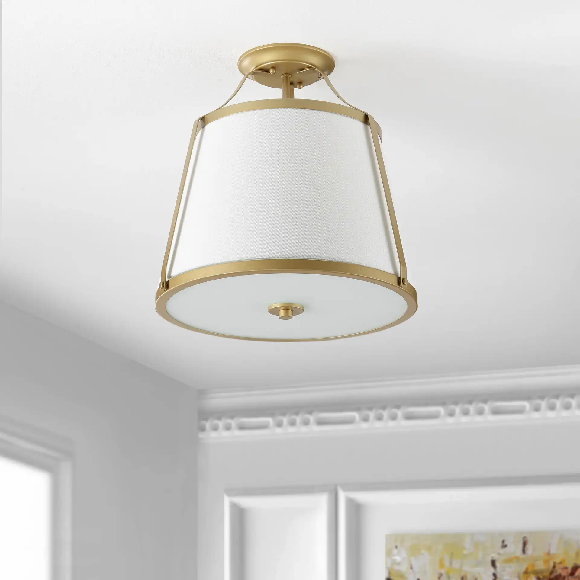 Lanis Three-Light Flush Mount in Gold in a styled room