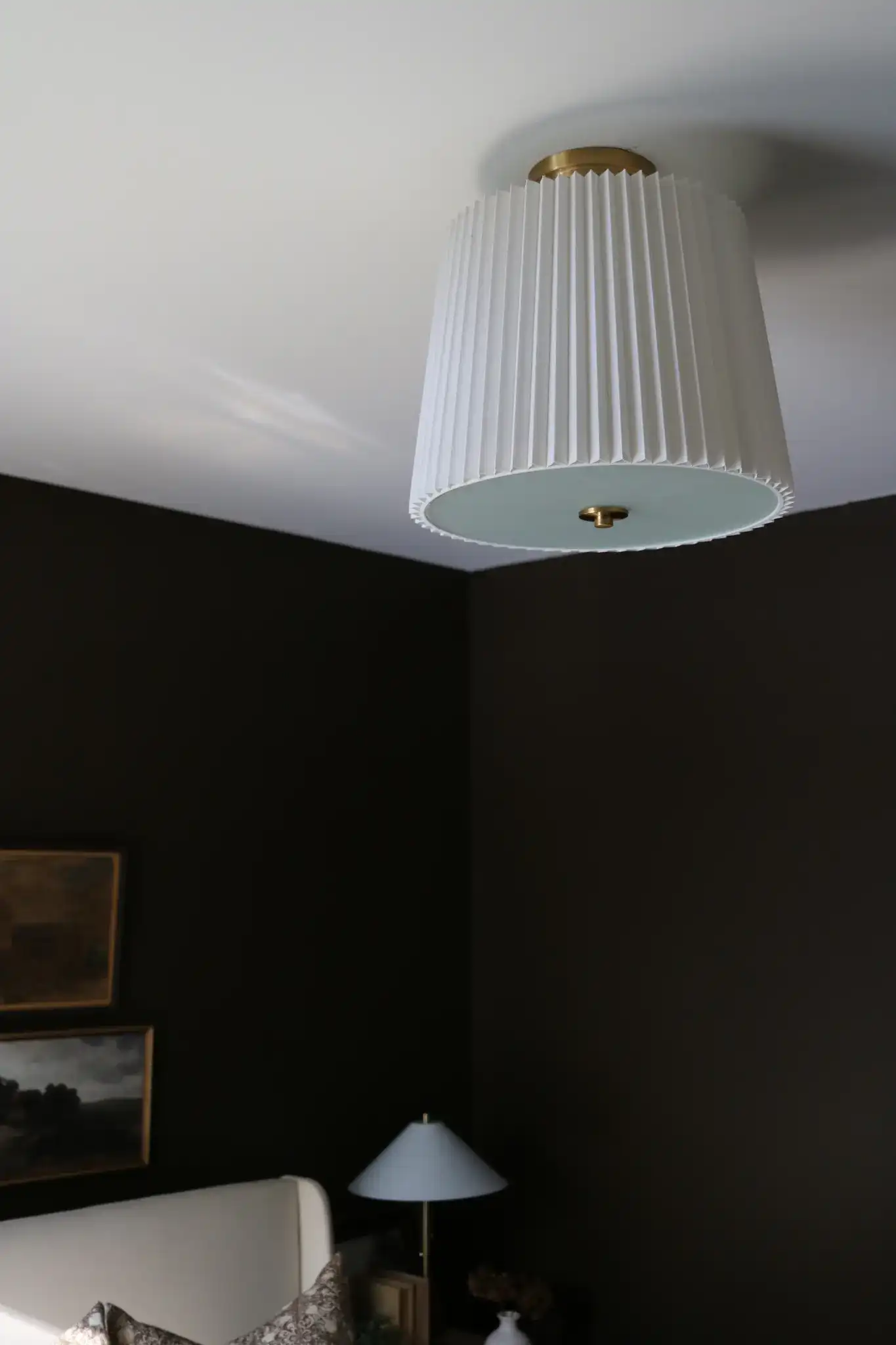Madio Three-Light Flush Mount in White / Gold in a styled room