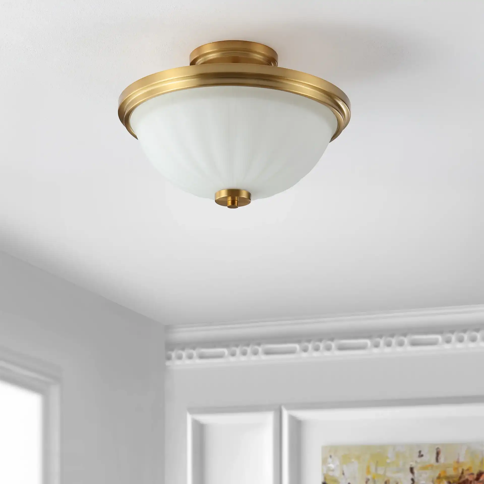 Okami Flush Mount in Brass in a styled room