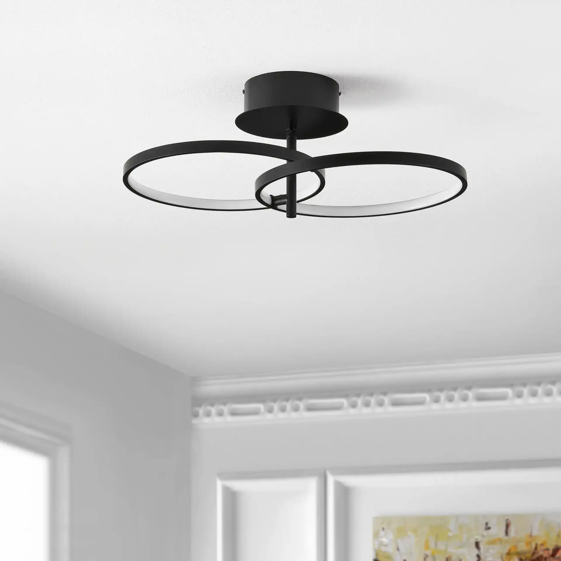 Reyah Led Flush Mount in Matte Black in a styled room