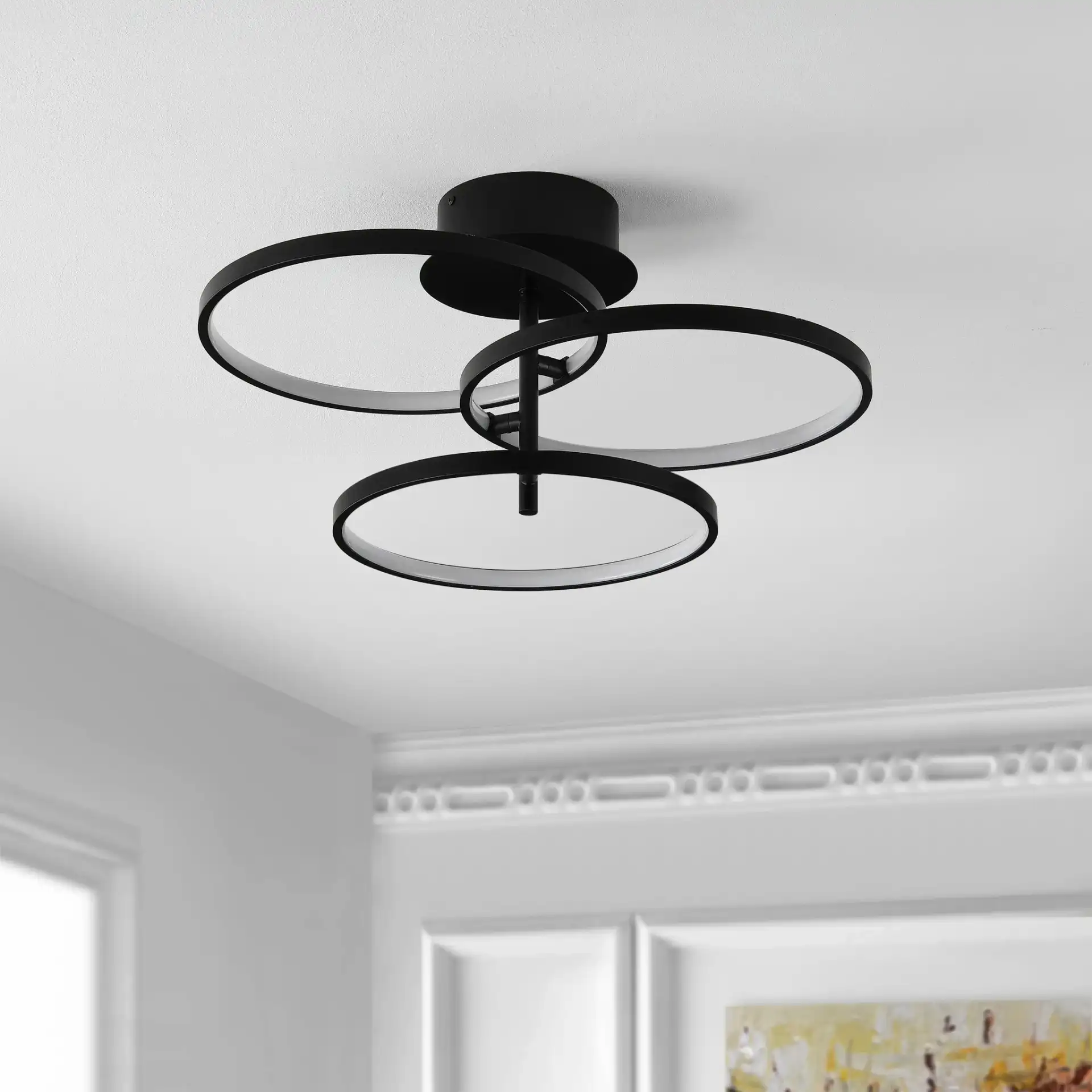 Saretta Led Flush Mount in Matte Black in a styled room