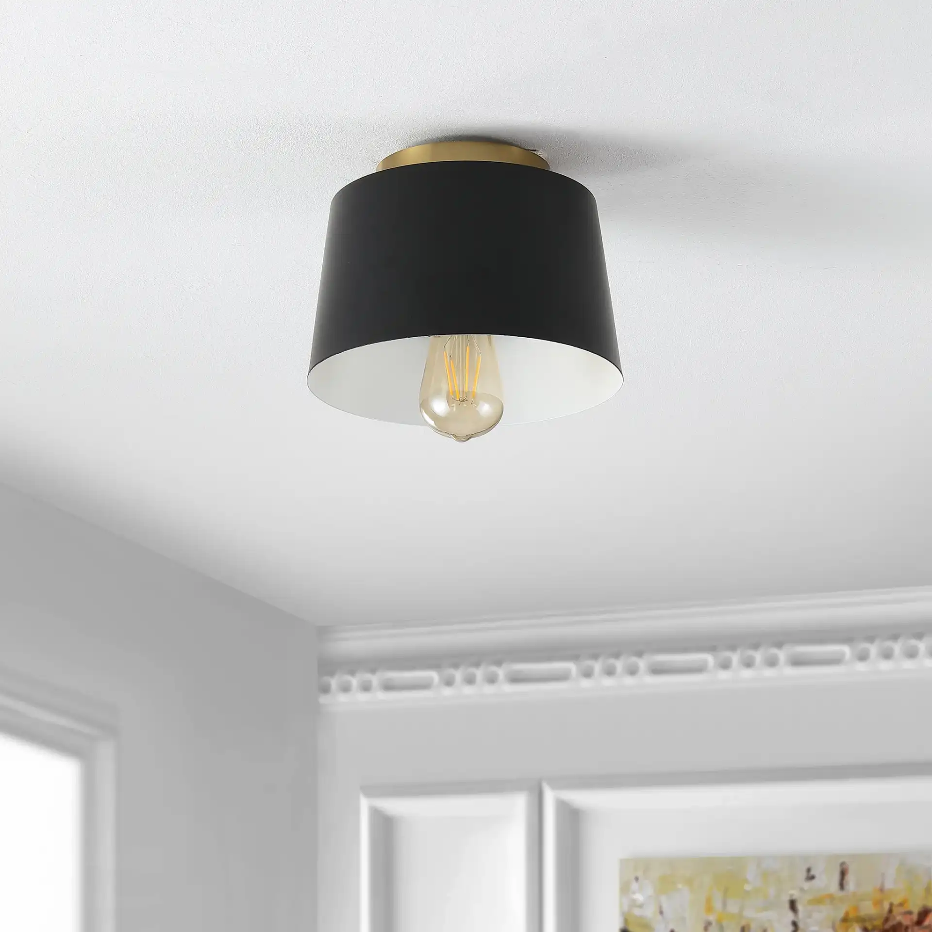 Parkes Flush Mount in Black / Brass in a styled room