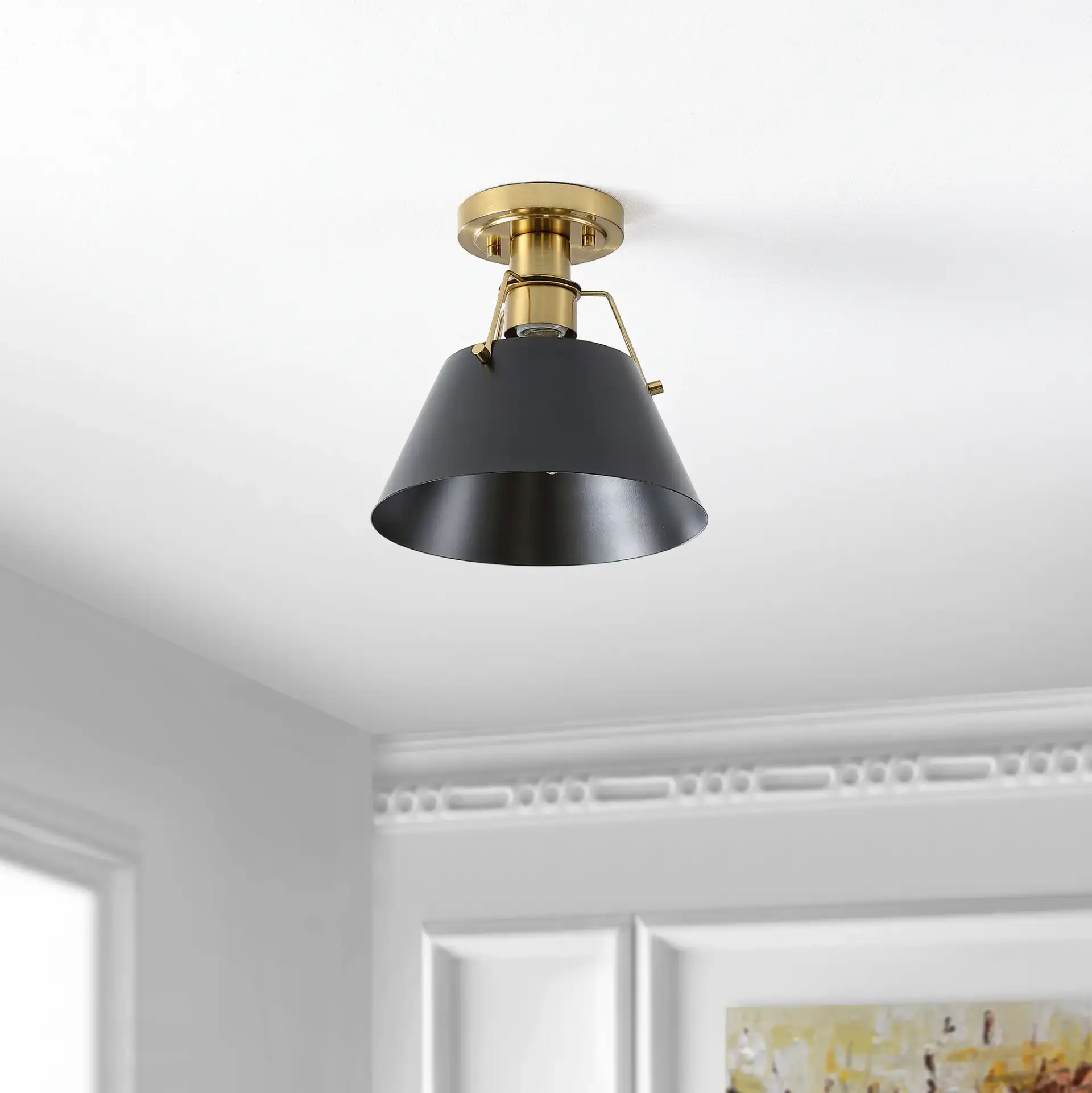 Mazelle Flush Mount in Black / Brass in a styled room