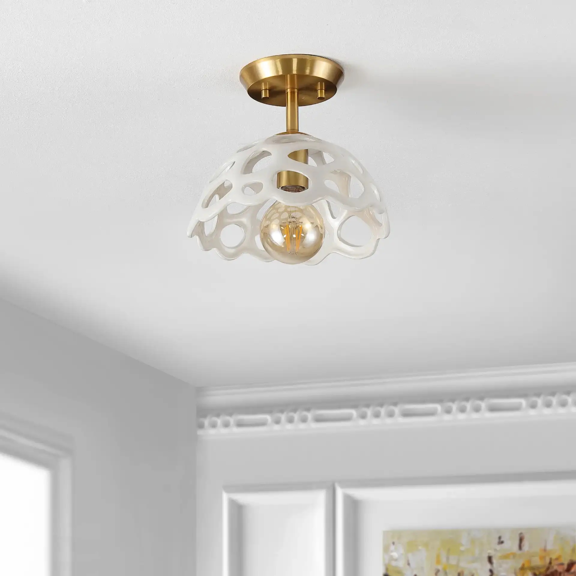 Eldrid Flush Mount in White / Gold in a styled room
