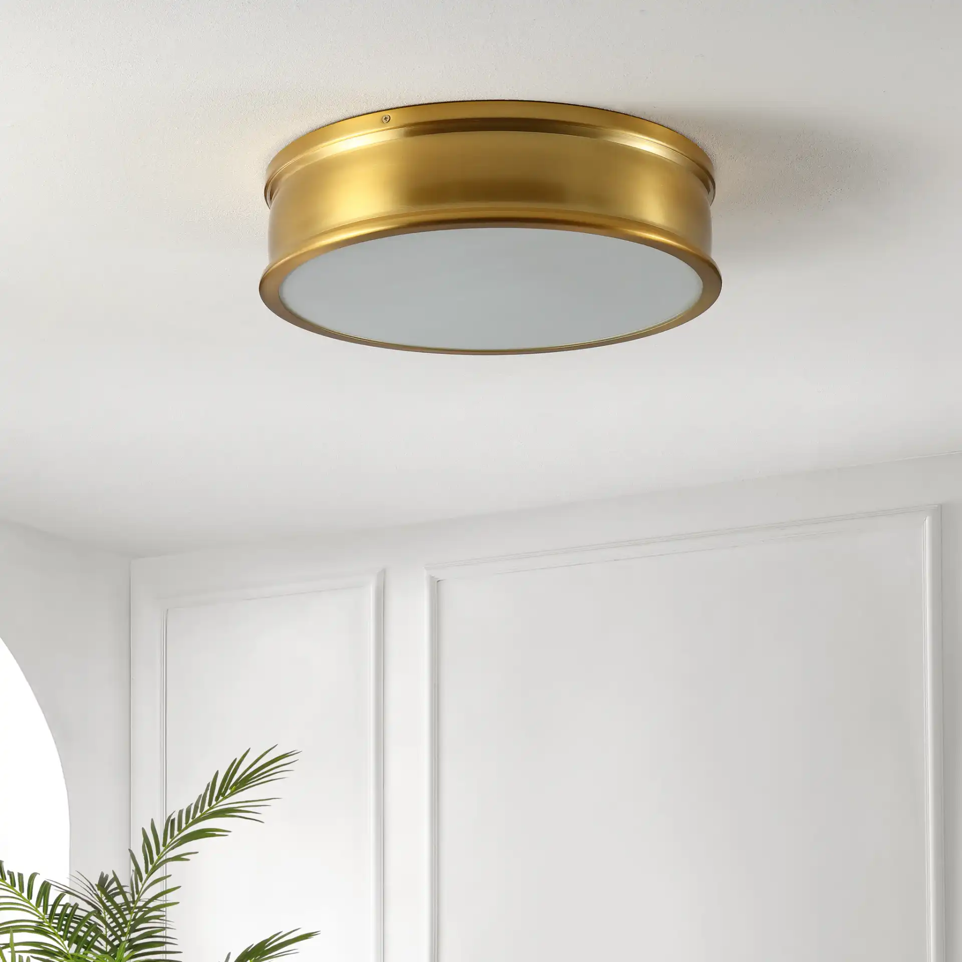 Adria Three-Light Flush Mount in Brass in a styled room