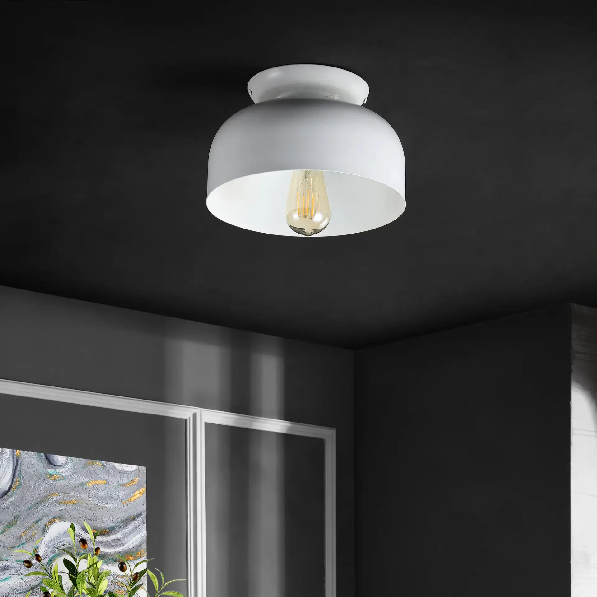 Danica Flush Mount in White in a styled room