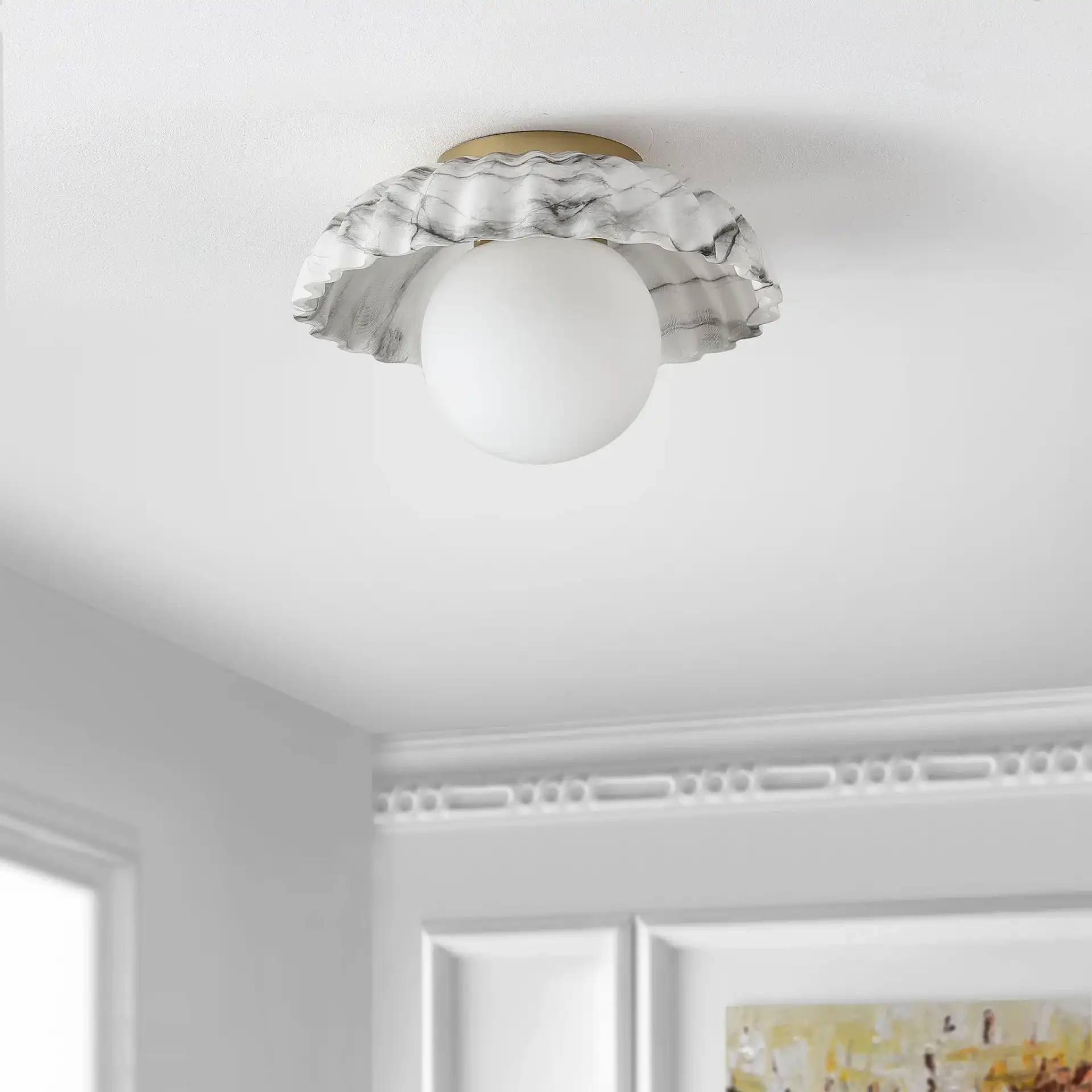 Grima Flush Mount in White Marble / Gold in a styled room