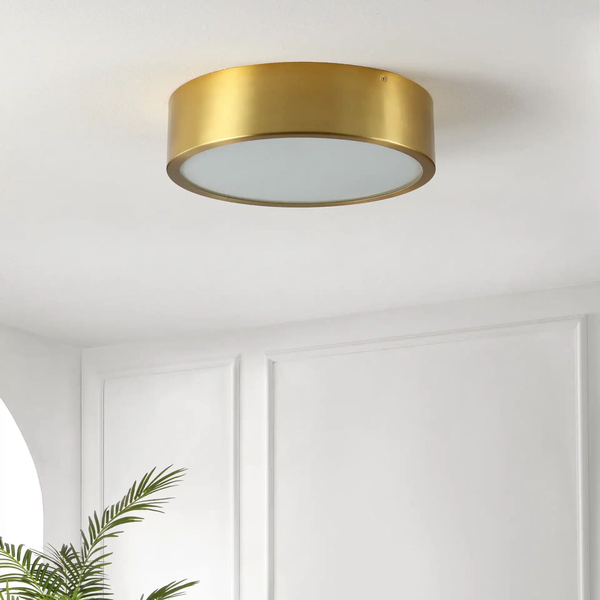 Reda Three-Light Flush Mount in Brass in a styled room