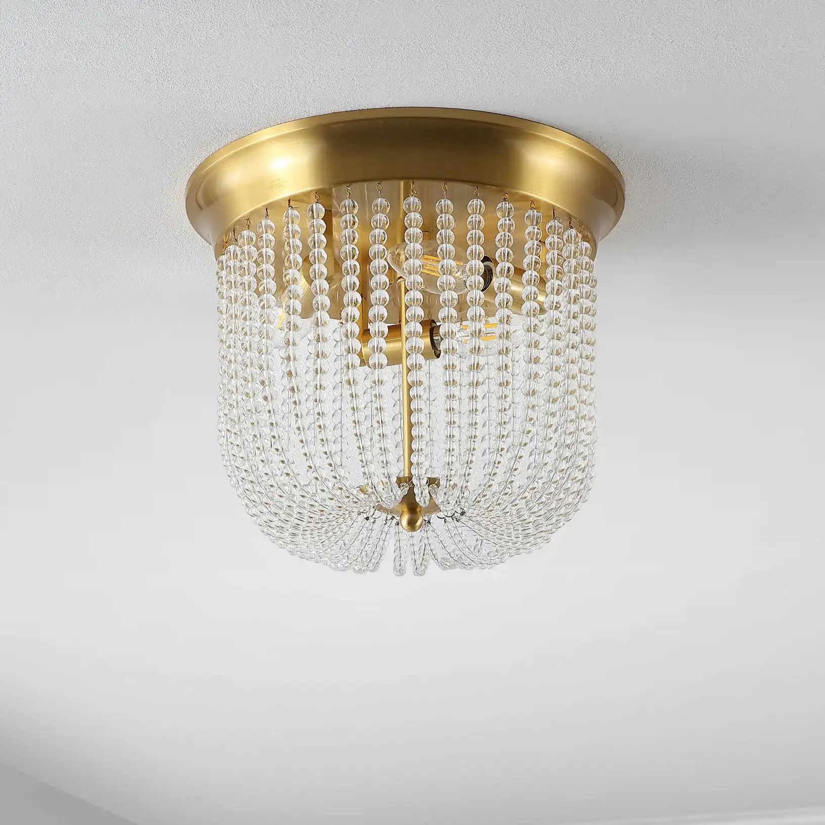 Sarella Three-Light Flush Mount in Gold, detail view
