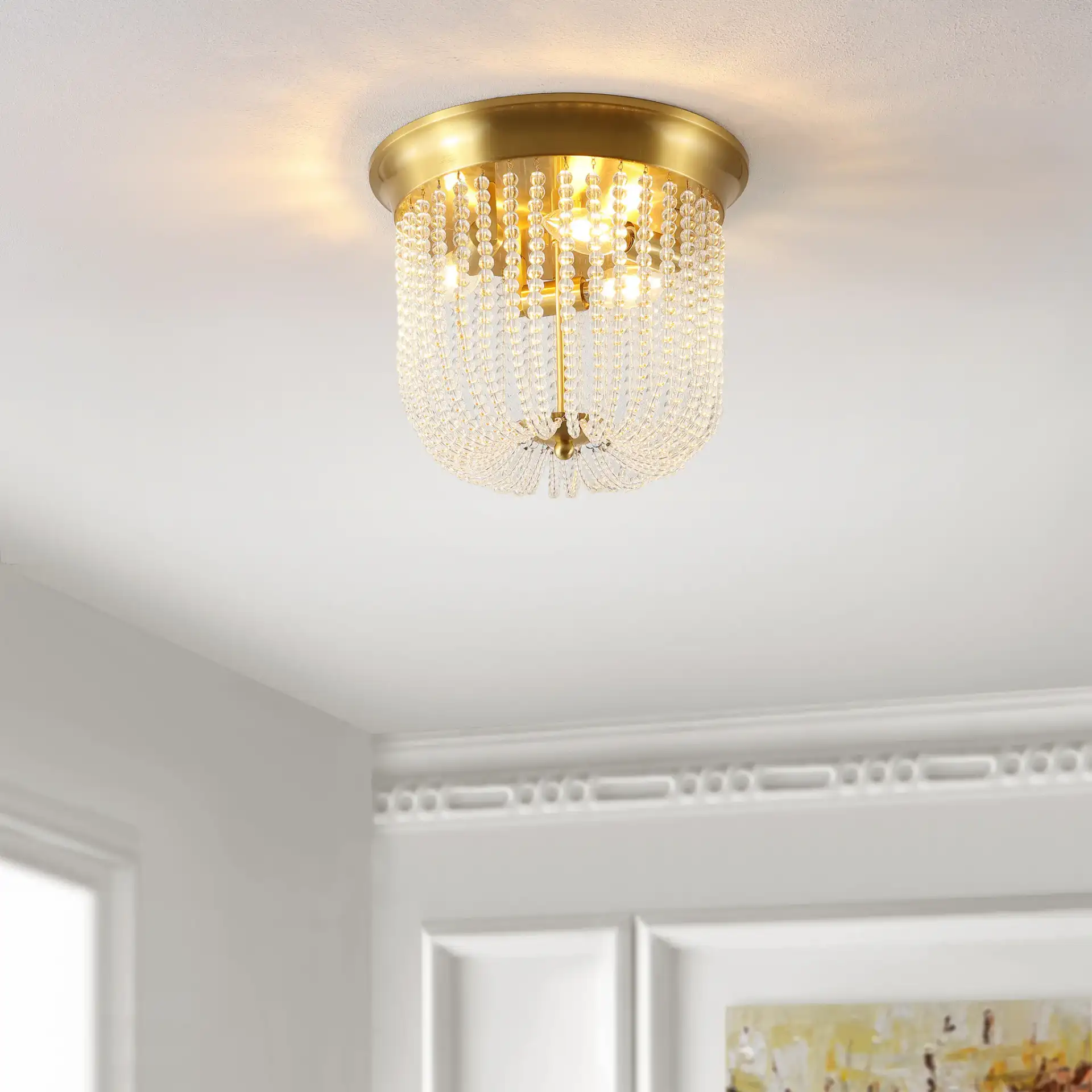 Sarella Three-Light Flush Mount in Gold in a styled room