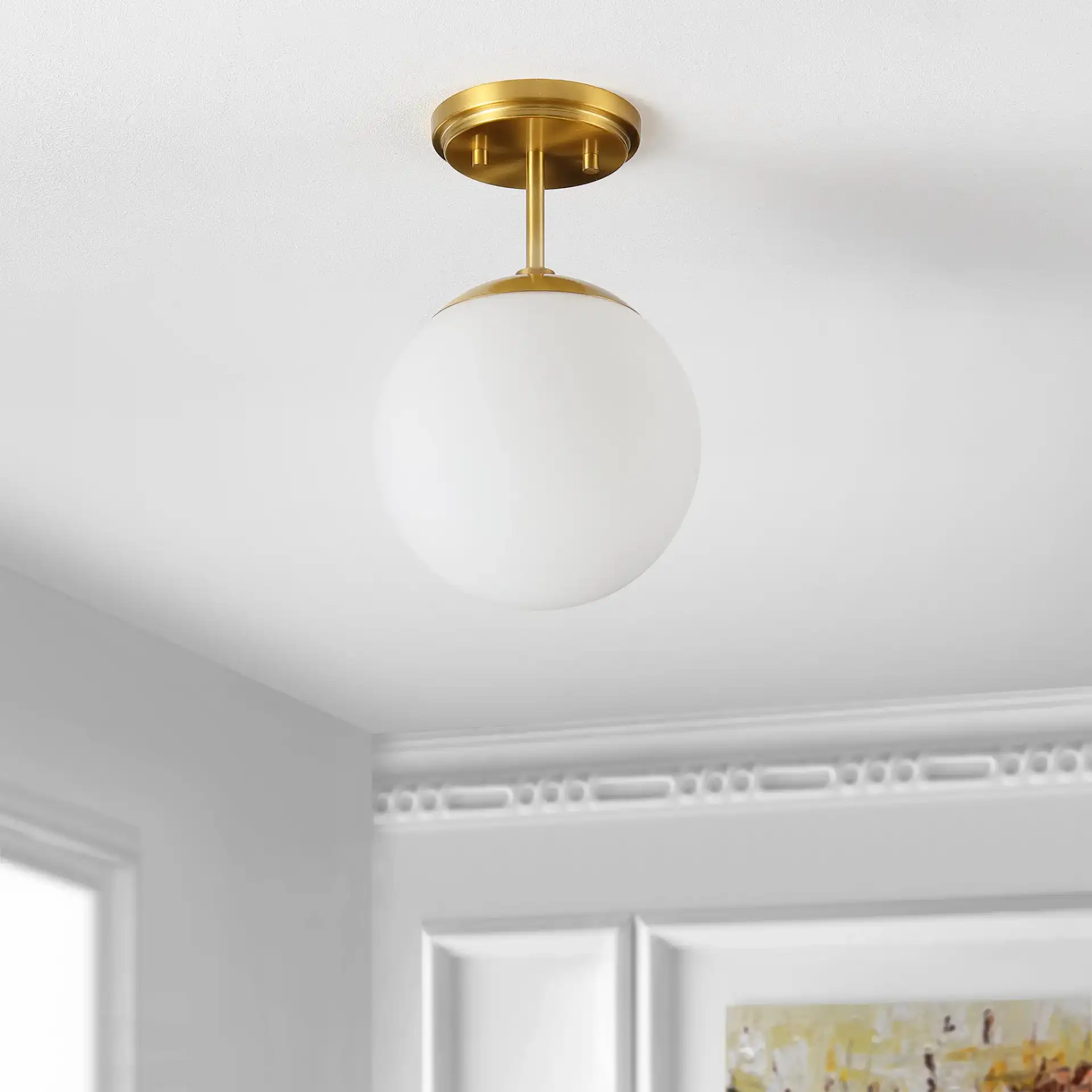 Catori Flush Mount in Brass in a styled room