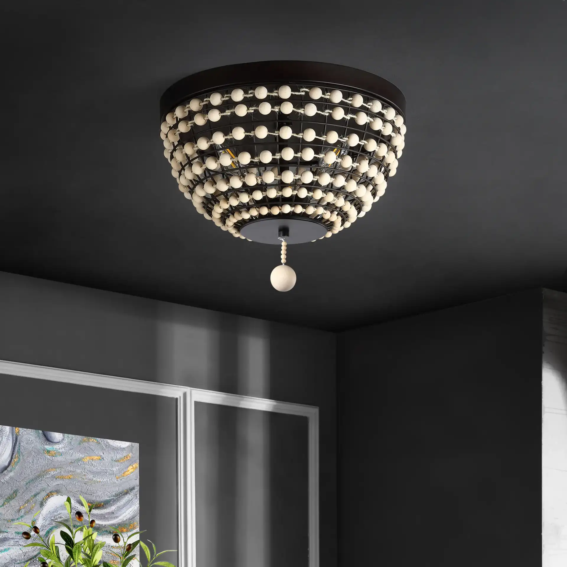 Bolson Three-Light Flush Mount in Bronze / Natural in a styled room