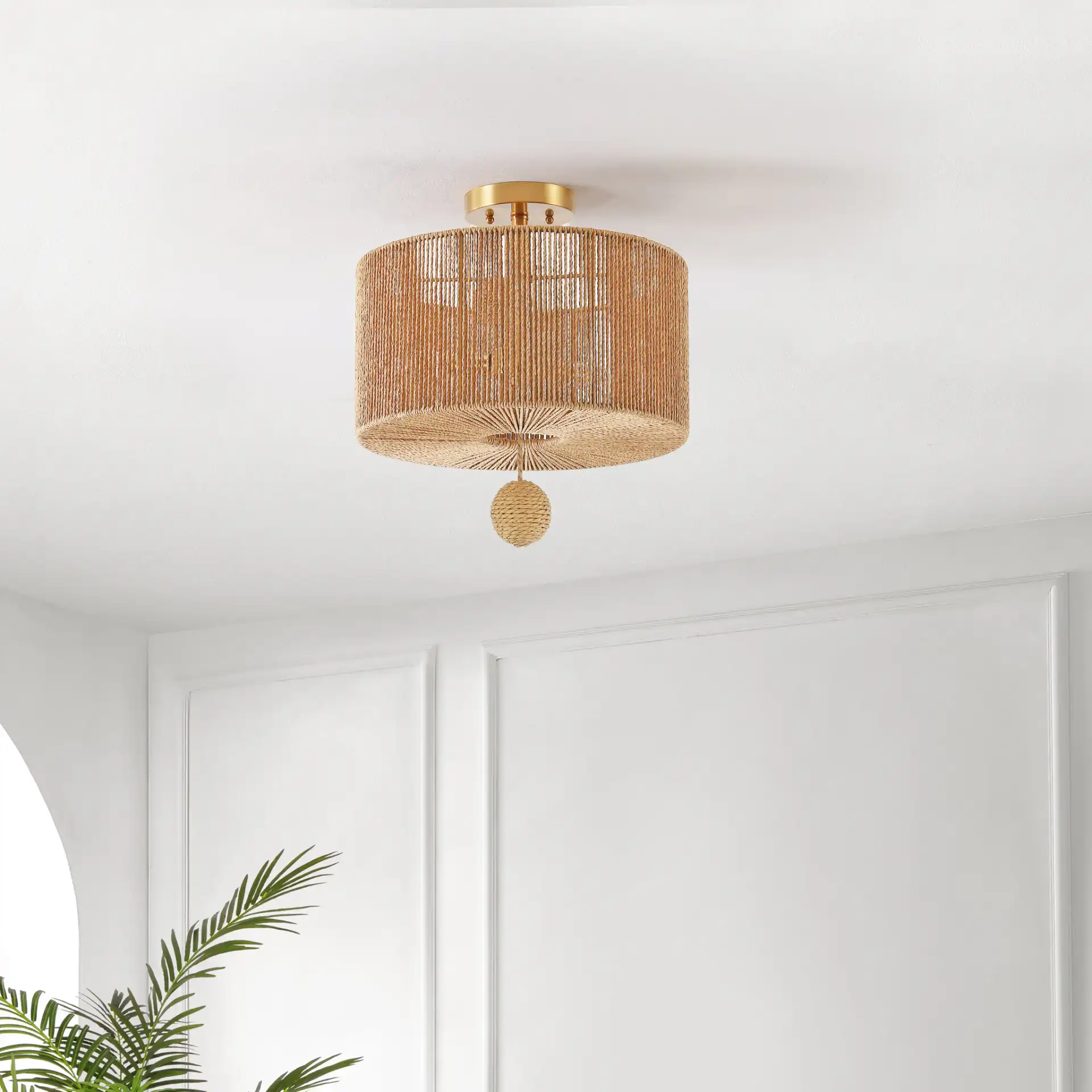 Solmaz Three-Light Flush Mount in Natural / Gold in a styled room