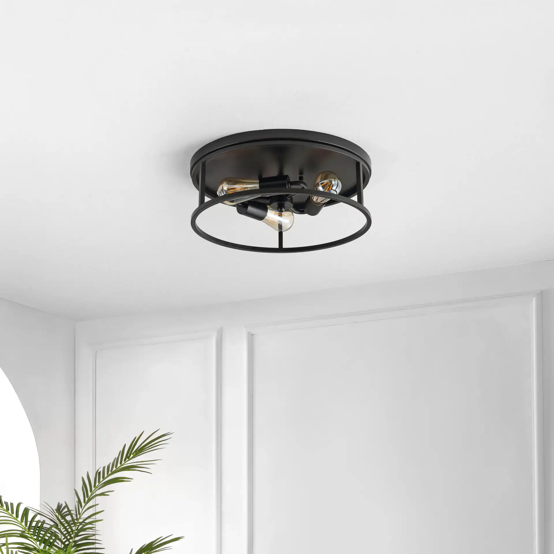 Broux Three-Light Flush Mount in Black in a styled room