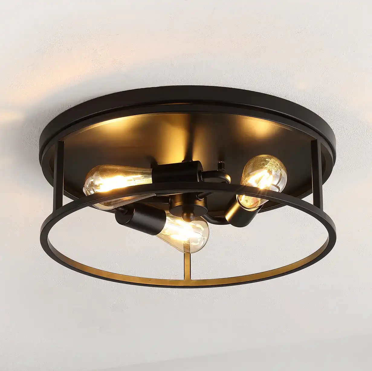 Broux Three-Light Flush Mount in Black in a styled room