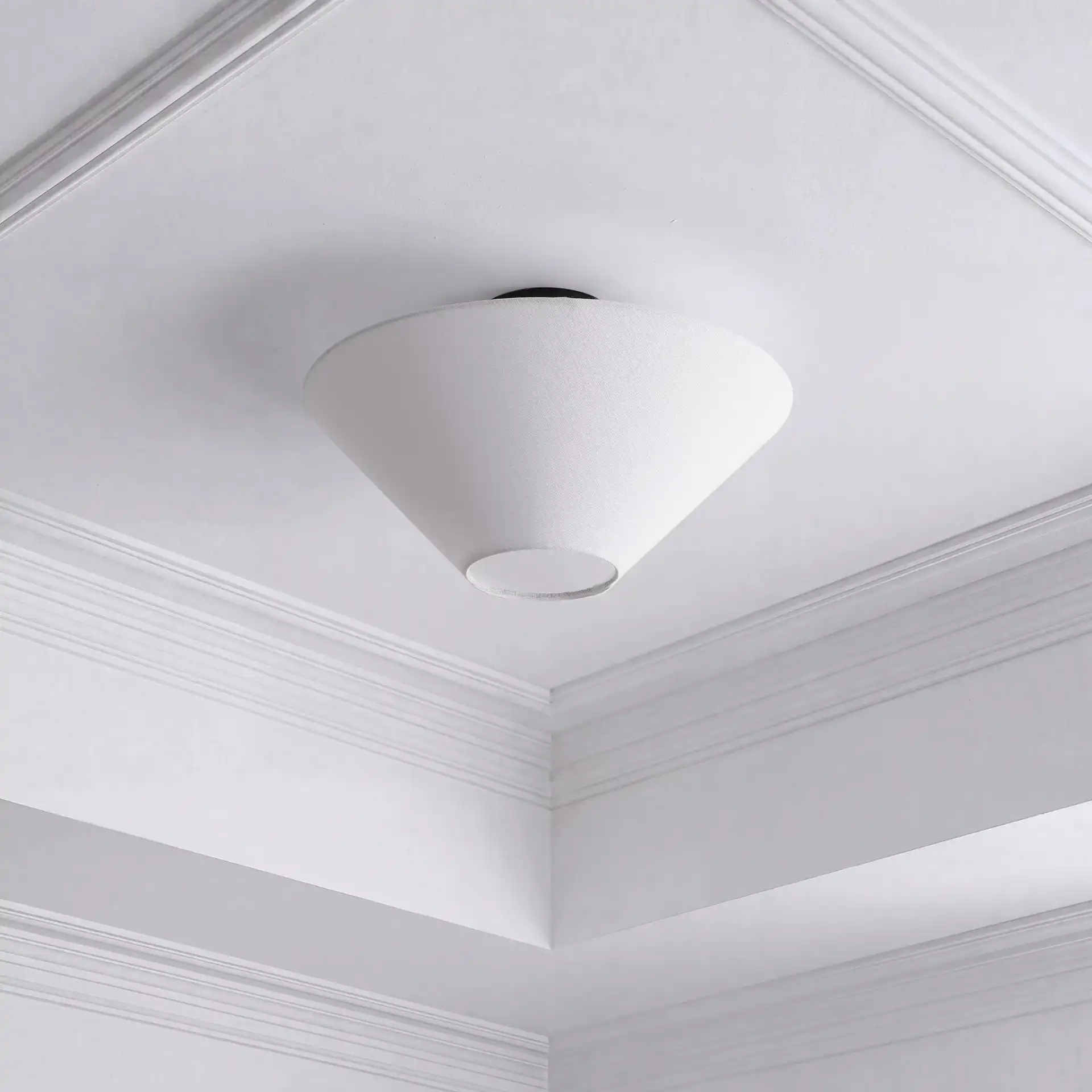 Oisten 18" Flush Mount Light in White / Black in a styled room