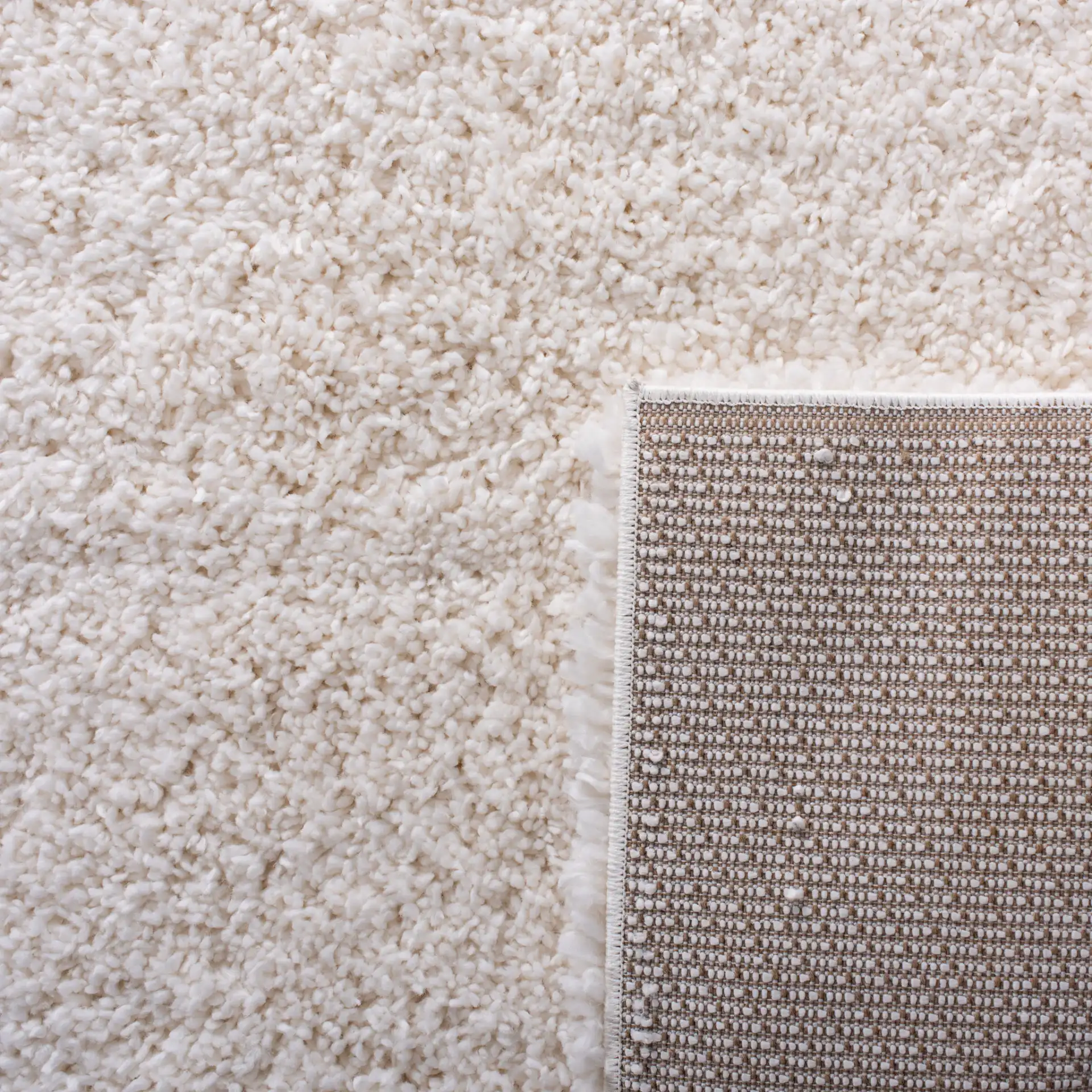 Fontana Solid Shag Rug in Ivory in a styled room